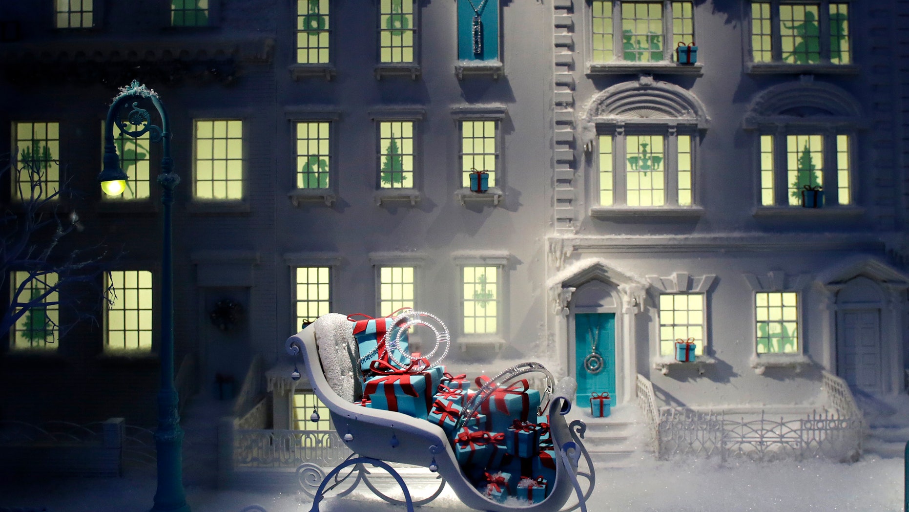 FILE - This Nov. 20, 2013, file photo, shows a sleigh filled with gift-wrapped jewelry boxes in a holiday window at Tiffany & Co., in New York. Tiffany & Co. reports earnings before U.S. stock markets open on Tuesday, Sept. 26, 2013. (AP Photo/Mark Lennihan, File)