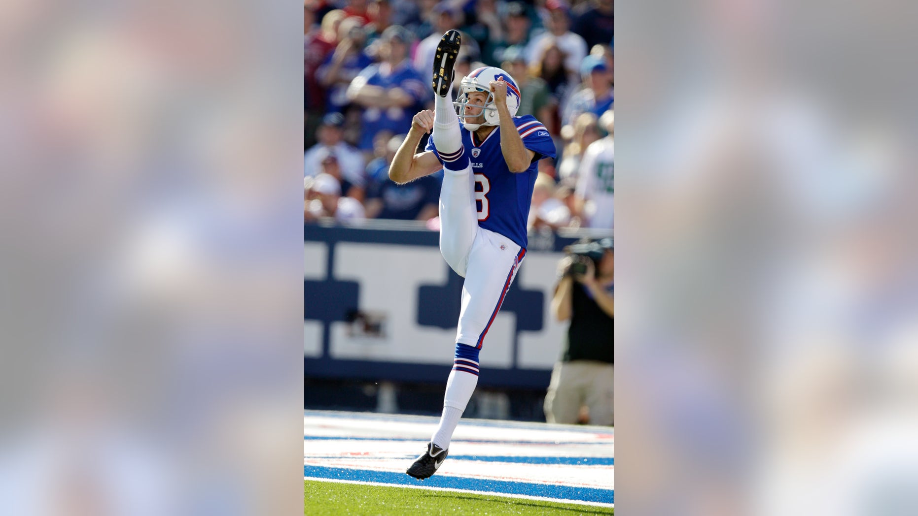 FILE - In this Oct. 9, 2011, file photo, Buffalo Bills punter Brian Moorman punts against the Philadelphia Eagles during the second half of an NFL football game in Orchard Park, N.Y. A year after being released by the Bills, Moorman is picking up where he left off with a team he spent his first 11-plus NFL seasons with after being re-signed last weekend. (AP Photo/David Duprey, File)