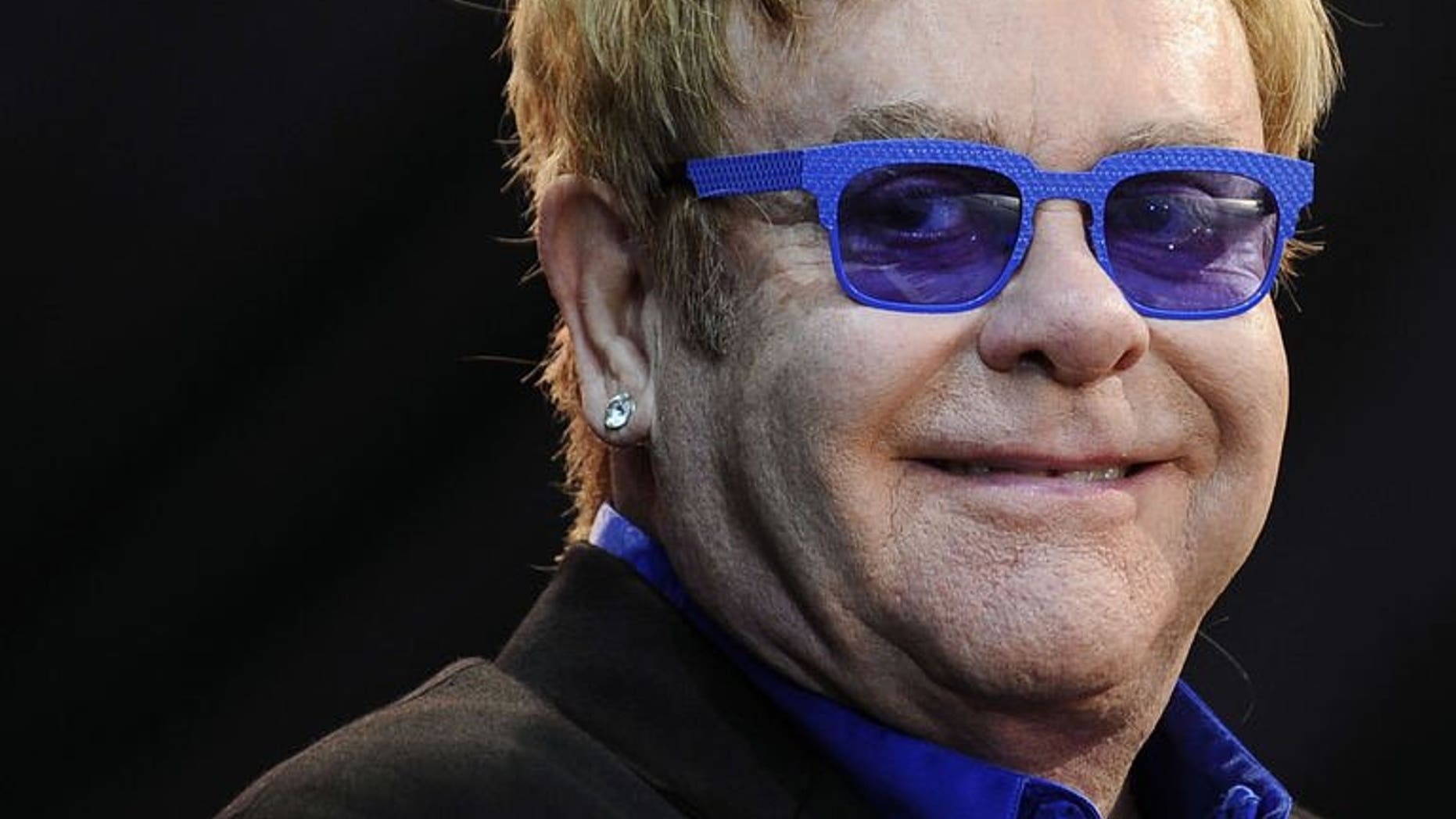 Elton John performs on stage during the Poupet festival on July 3, 2013 in Saint-Laurent-sur-Sevre, western France. John has cancelled the rest of his European tour after he was struck down with appendicitis, his spokesman said on Tuesday.