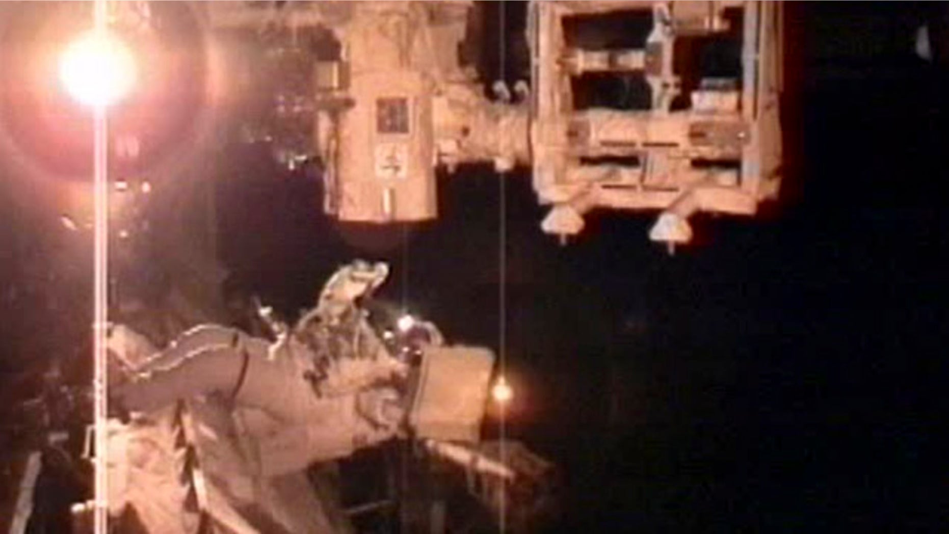 In this image taken from NASA television astronaut Andrew Feustel, prepares his tools that he will use to lubricate DEXTER platform's robotic arm during the second space walk early Sunday May 22, 2011.