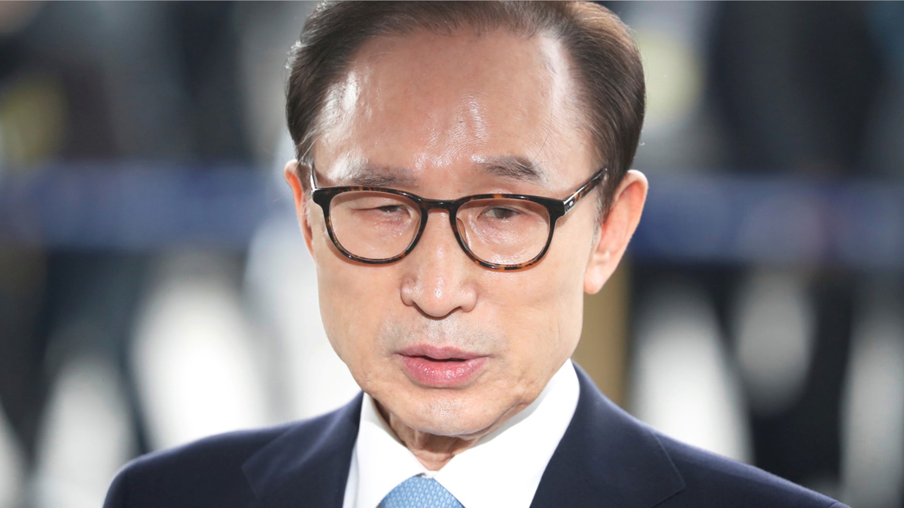 FILE: South Korea's former president Lee Myung-bak arrives at the prosecutors' office in Seoul.