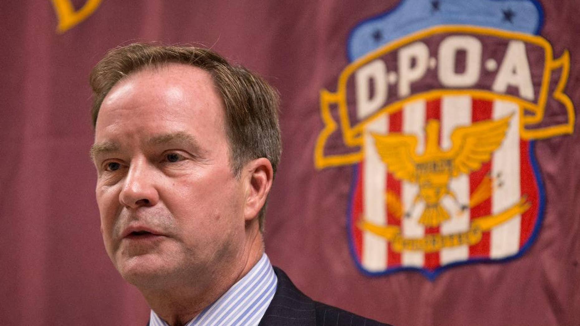 FILE - In this Sept. 10, 2014 file photo, Attorney General Bill Schuette speaks at the Detroit Police Officers Association in Detroit. Michigan’s attorney general Schuette will announce criminal charges Wednesday, April 20, 2016, against two state regulators and a Flint employee, alleging wrongdoing related to the city’s lead-tainted water crisis, according to government officials familiar with the investigation. (AP Photo/Paul Sancya, File)
