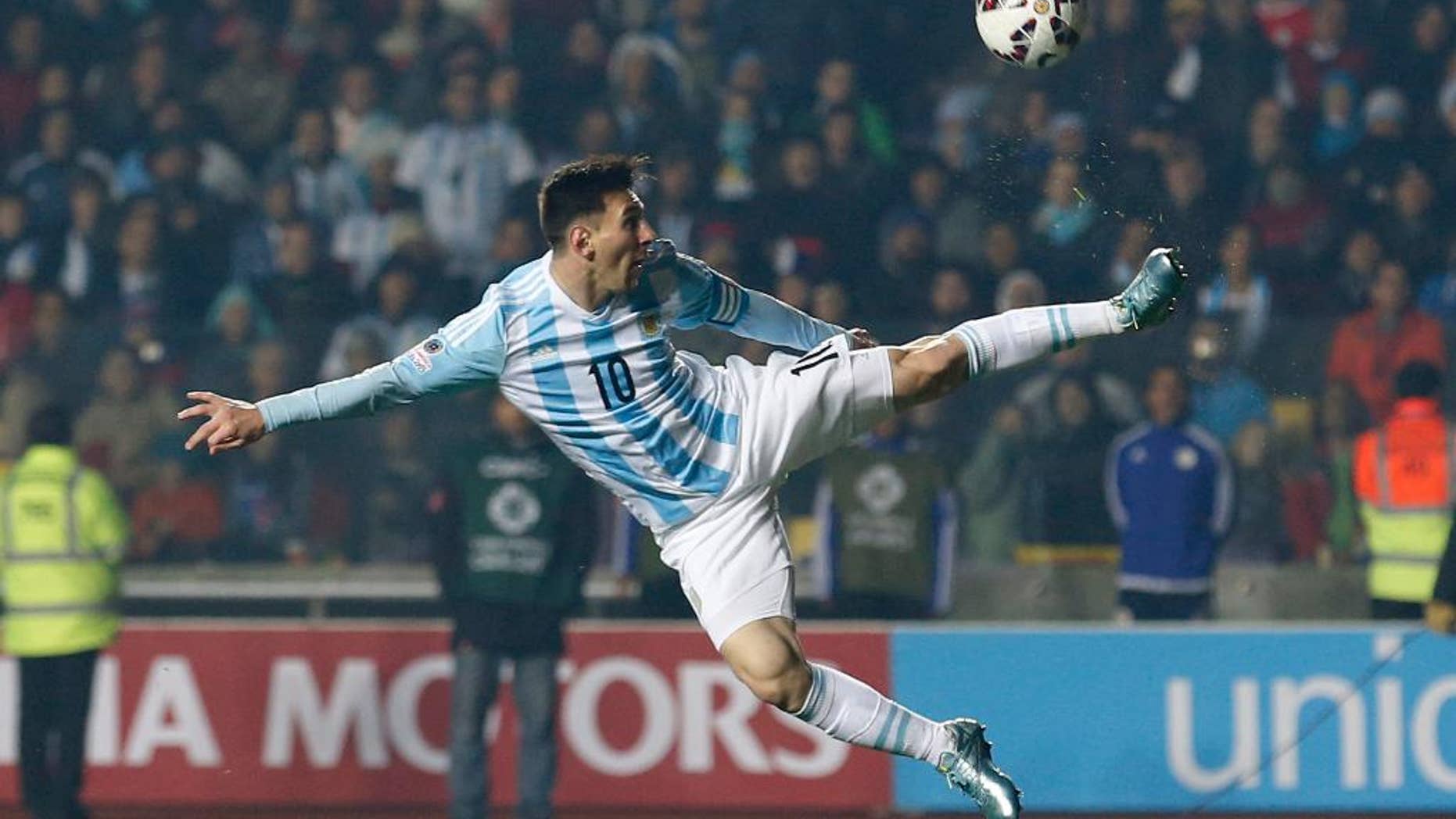 FILE - In this June 30, 2015, file photo, Argentina's Lionel Messi kicks the ball during a Copa America semifinal soccer match against Paraguay at the Ester Roa Rebolledo Stadium in Concepcion, Chile. (AP Photo/Silvia Izquierdo, File)