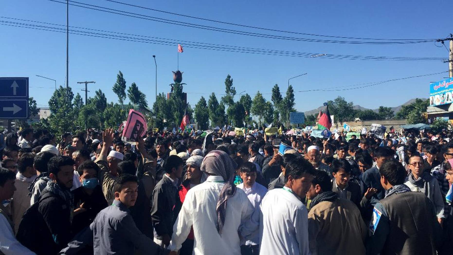 Hazara demonstrators gather to start marching toward the center of Kabul.