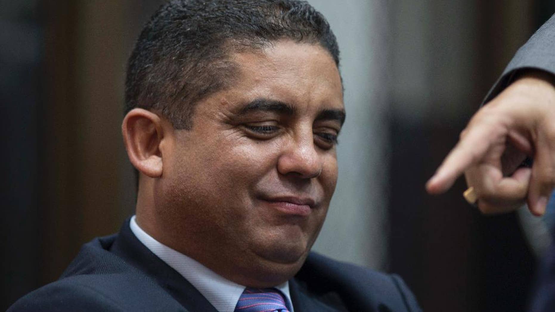 Juan Carlos Monzon, the personal secretary of former Vice President Roxana Baldetti, appears before a court hearing after he turned himself into authorities in Guatemala City, Monday, Oct. 5, 2015. Monzon is accused by authorities of being the head of a corruption ring, known as "La Linea," in which businesses allegedly paid kickbacks to government officials in exchange for lower import duties. It is believed that the scheme bilked the government of millions of dollars. The corruption scandal has rocked the Guatemalan government and so far has caused former President Otto Perez Molina and Baldetti to resign. Both are jailed and are facing charges for allegedly receiving the illegal payments. Prosecutors and an international commission have said Perez Molina and Baldetti were fully aware of the scheme and received half of the kickbacks paid. (AP Photo/Luis Soto)