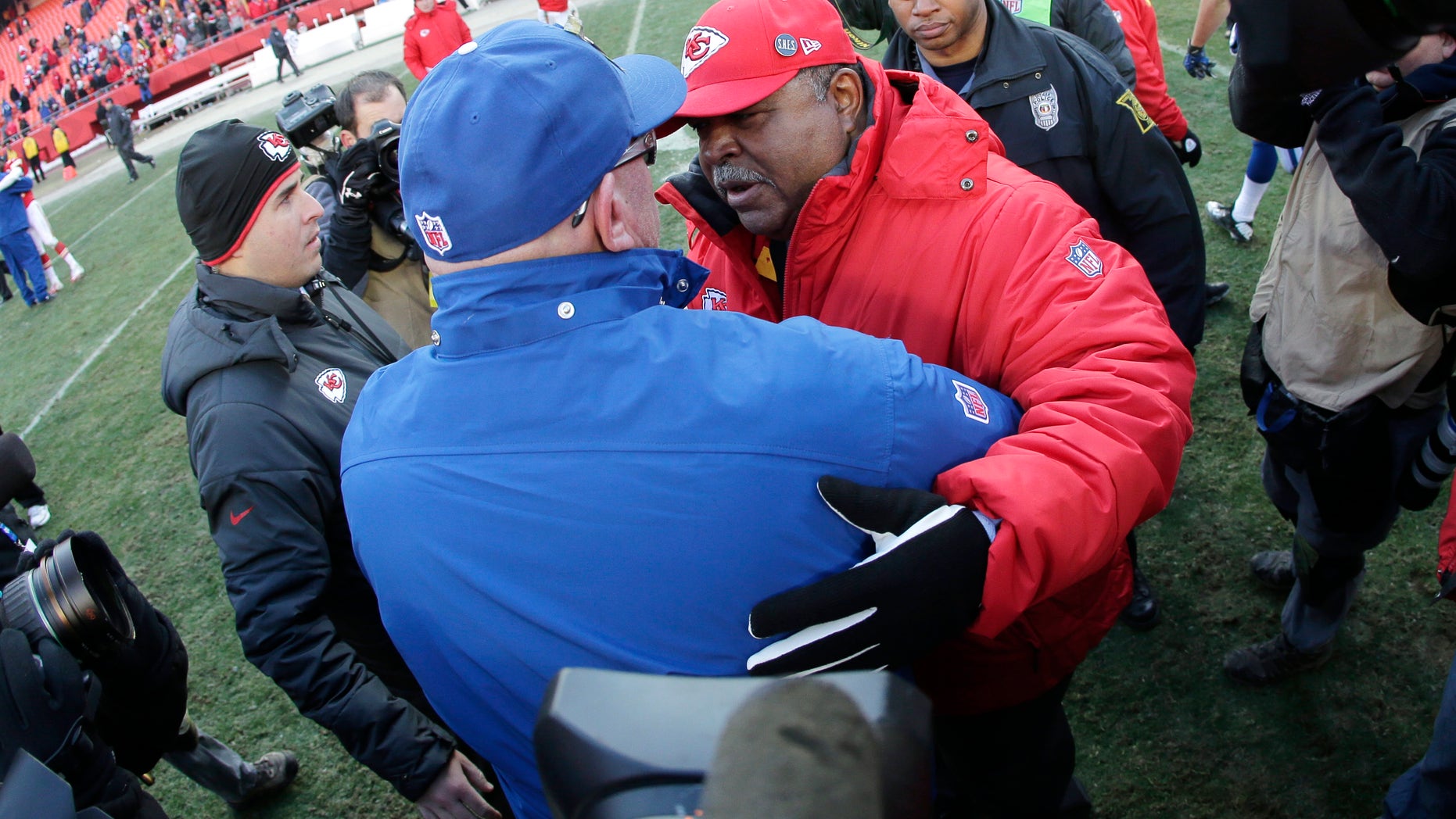 Indianapolis Colts interim coach Bruce Arians, left, talks with Kansas City Chiefs coach Romeo Crennel after an NFL football game Sunday, Dec. 23, 2012, in Kansas City, Mo. The Colts won 20-13. (AP Photo/Charlie Riedel)