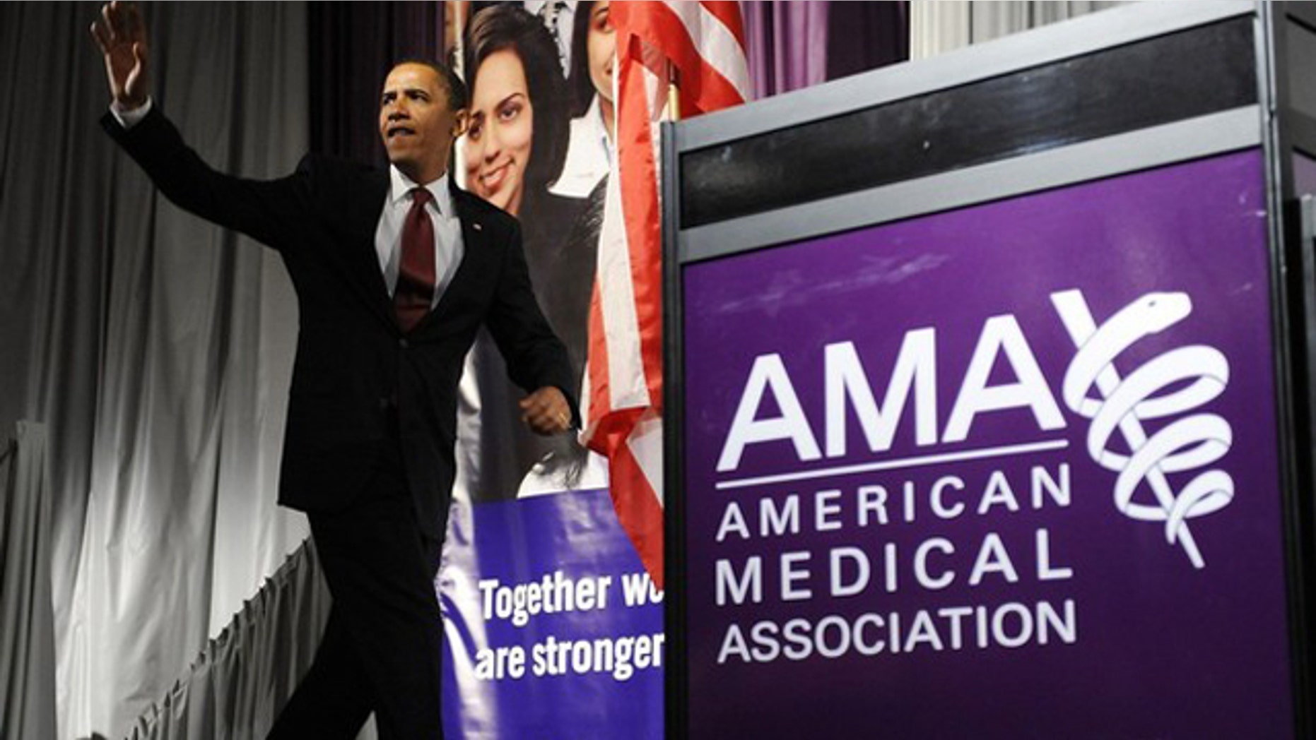 In this June 15, 2009, photo, President Obama arrives to deliver remarks on the health care system at the annual meeting of the American Medical Association in Chicago.