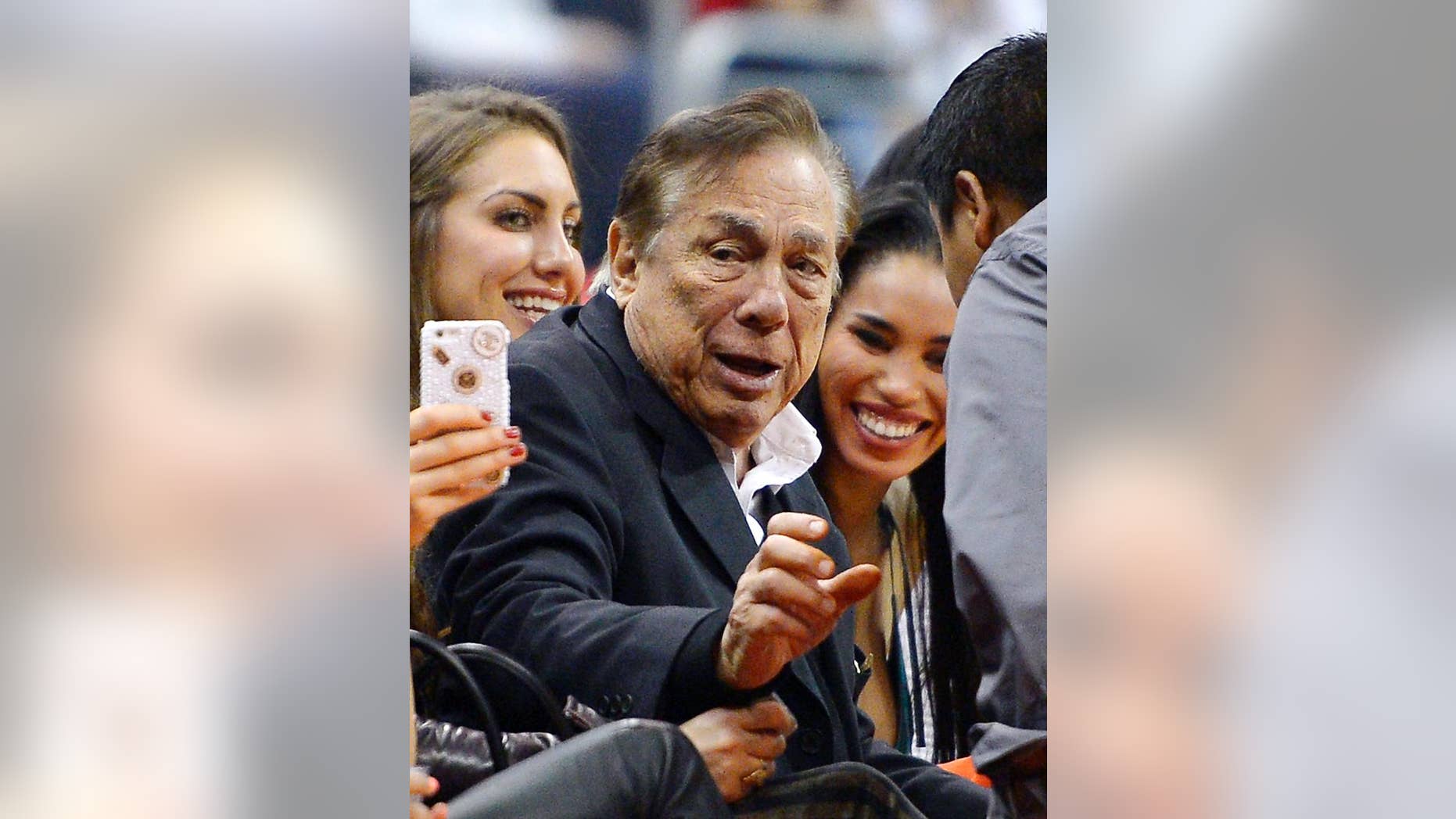 FILE - In this Oct. 25, 2013 file photo, Los Angeles Clippers owner Donald Sterling gestures as the Clippers play the Sacramento Kings during the first half of an NBA basketball game in Los Angeles. The future of the Clippers is closer to decision as testimony resumes Monday, July 21, 2014, in a probate trial over whether a deal negotiated by Donald Sterling's estranged wife to sell the team for $2 billion is authorized under a Sterling family trust. (AP Photo/Mark J. Terrill, File)