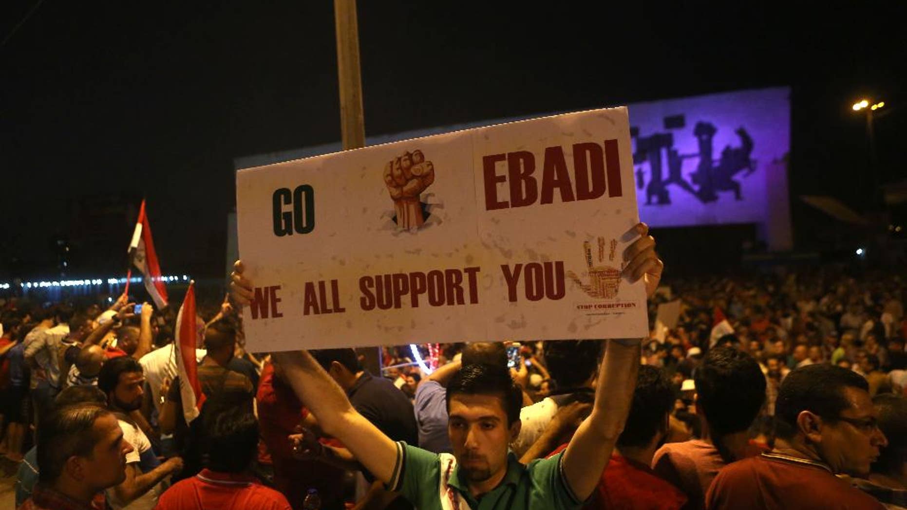 Demonstrators chant in support of Iraqi Prime Minister Haider al-Abadi during a demonstration at Tahrir Square in Baghdad, Iraq, Sunday, Aug. 9, 2015. Iraq's prime minister unveiled a bold plan Sunday to abolish three vice presidential posts and the offices of three deputy premiers, hoping to cut spending amid mass protests against his government as the Islamic State group still holds a third of his nation. (AP Photo/Khalid Mohammed)