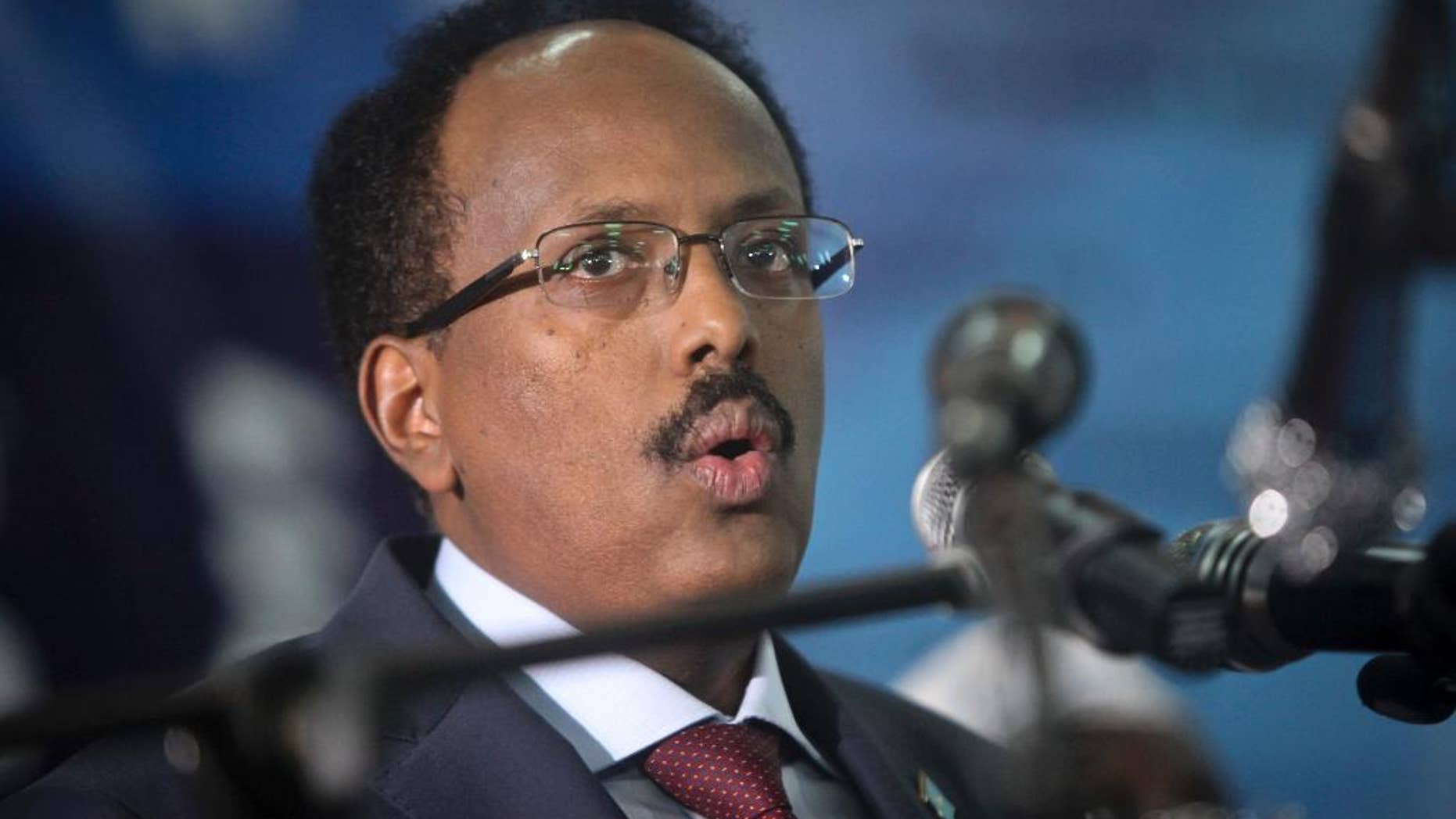 Somalia's President Mohamed Abdullahi Mohamed speaks at his inauguration ceremony in Mogadishu, Somalia, Wednesday, Feb. 22, 2017. Somalia's new leader, who also holds U.S. citizenship, was inaugurated Wednesday while promising to restore dignity to the troubled Horn of Africa nation but warning it will take another two decades to "fix" the country. (AP Photo/Farah Abdi Warsameh)