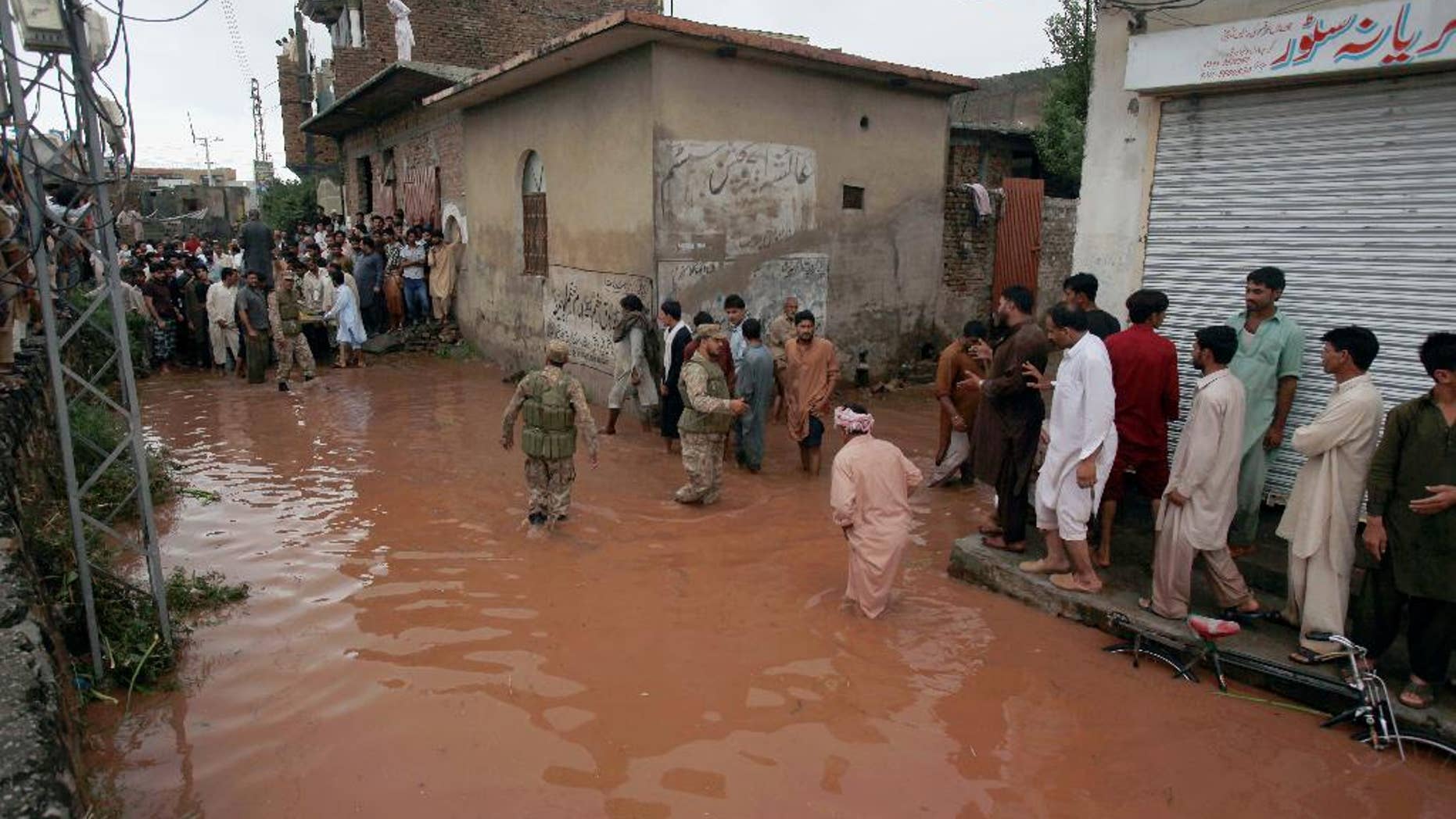 Sept. 5, 2014: Pakistani army troops rescue local residents from a flooded area caused by heavy rains on the outskirts of Islamabad, Pakistan.