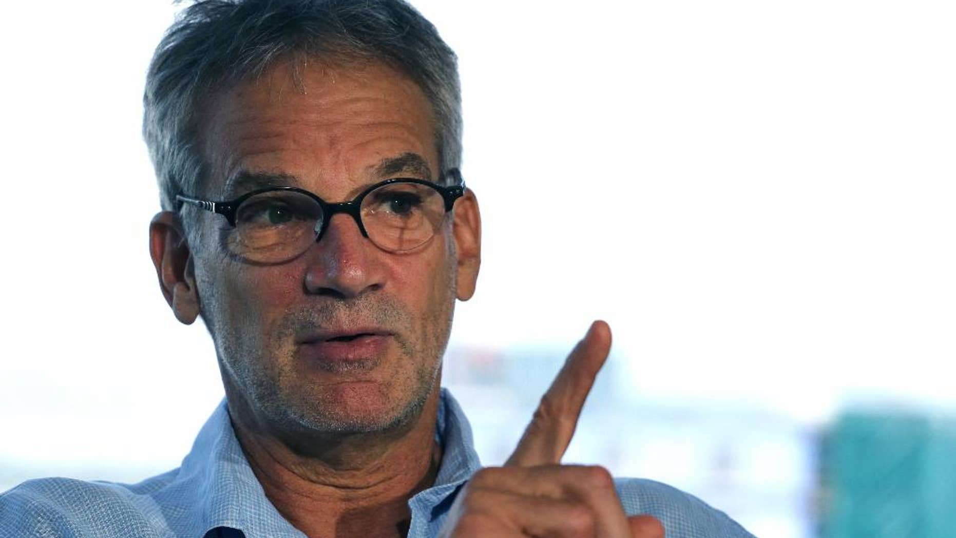FILE - In this Sept. 17, 2014, file photo, Colorado-based author Jon Krakauer speaks during an interview, in Denver. Krakauer wrote the book, "Under the Banner of Heaven," about a Utah prison inmate serving a life sentence for killing his family. According to police, the inmate received letters from a woman who was found dead, along with her husband and three children, due to a drug overdose. (AP Photo/Brennan Linsley, File)