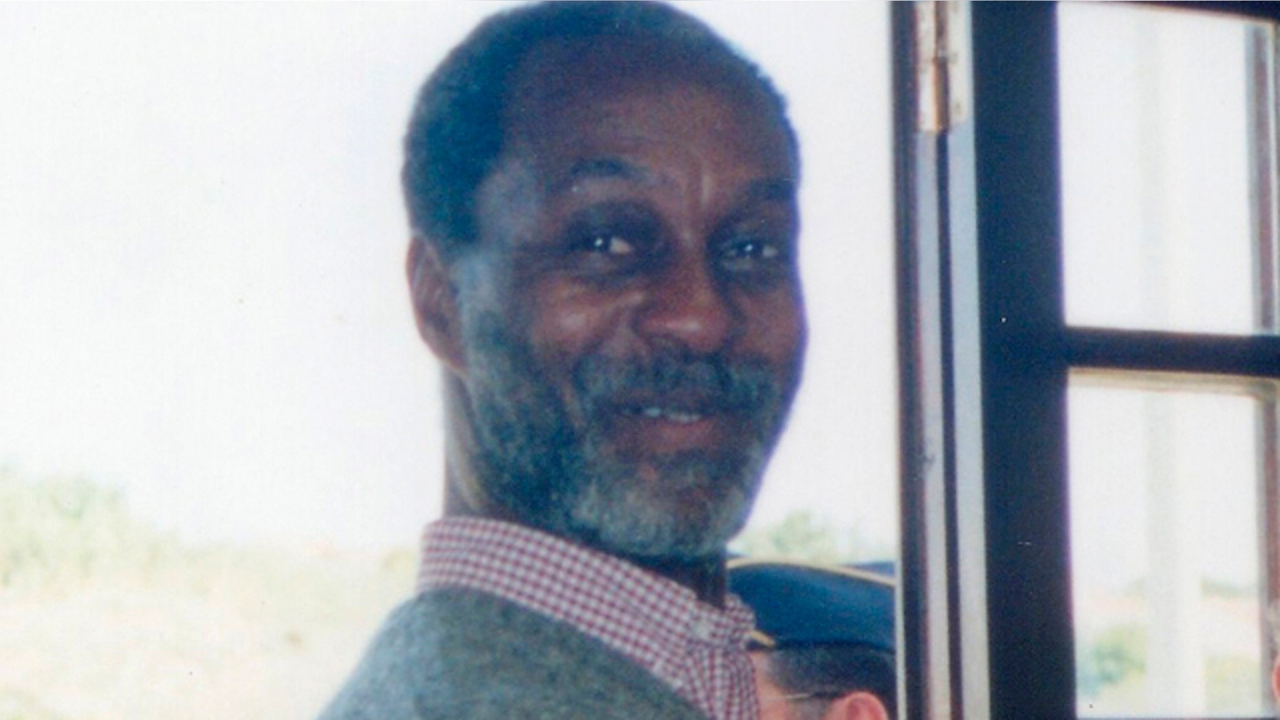 In this photo released by Noticias de Colares on Thursday Sept. 29, 2011, U.S. fugitive George Wright is seen in a post office in Praia das Macas, Portugal in 2000.