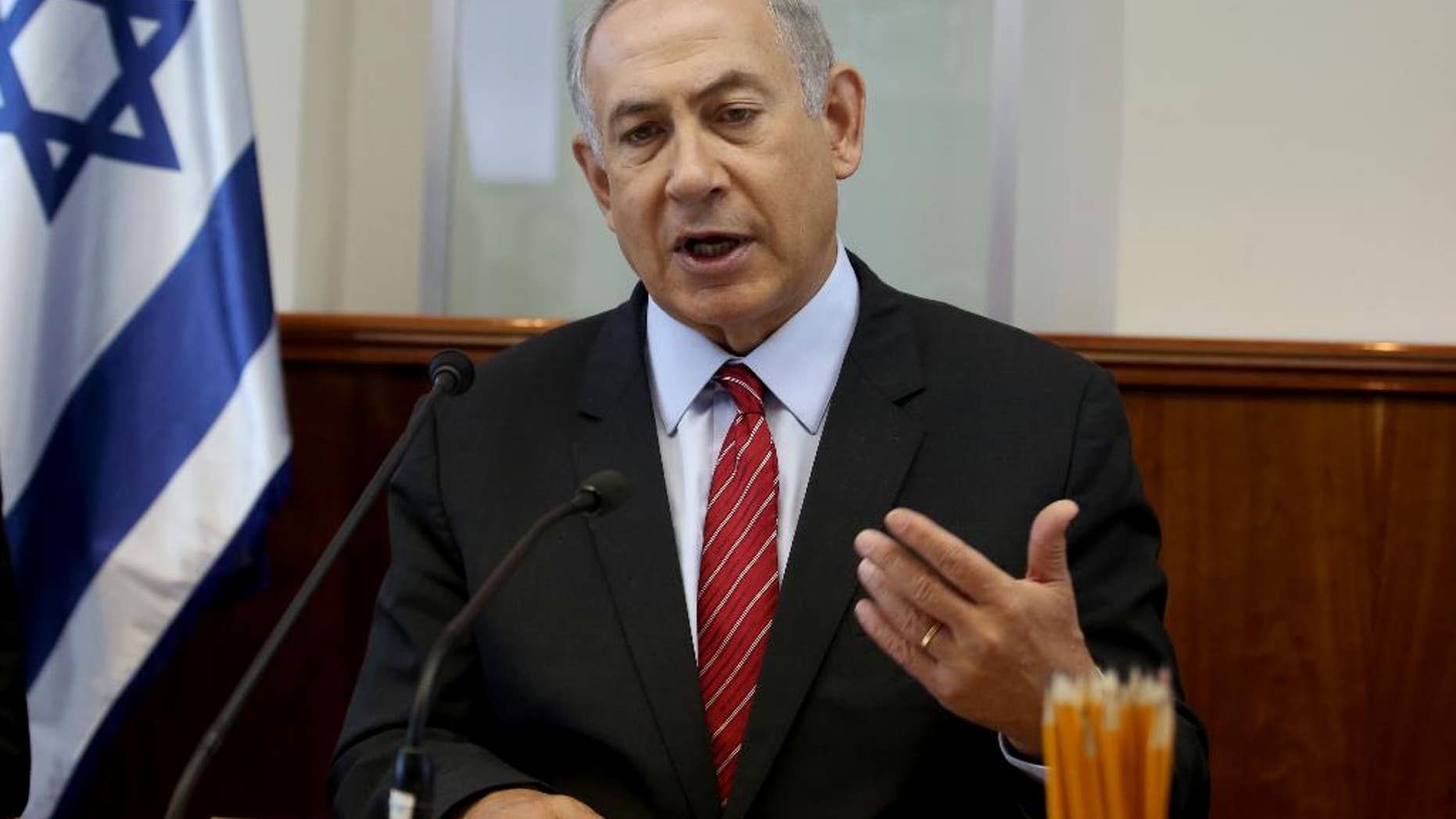 FILE - In this Sept. 11, 2016 file-pool photo, Israeli Prime Minister Benjamin Netanyahu gestures as he opens the weekly cabinet meeting at his Jerusalem office. The U.S. will provide Israel's military with $38 billion during the next 10 years, officials said Tuesday, Sept. 13, 2016, the largest batch of military assistance the U.S. has ever pledged to another country. Netanyahu’s office confirmed in a brief statement that a deal had been reached, but offered no additional comment. (Gali Tibbon, Pool via AP, File)