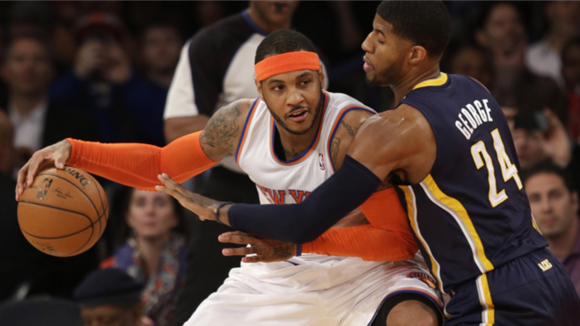 Anthony tries to move around Indiana Pacers' Paul George in this March 19, 2014, file photo.