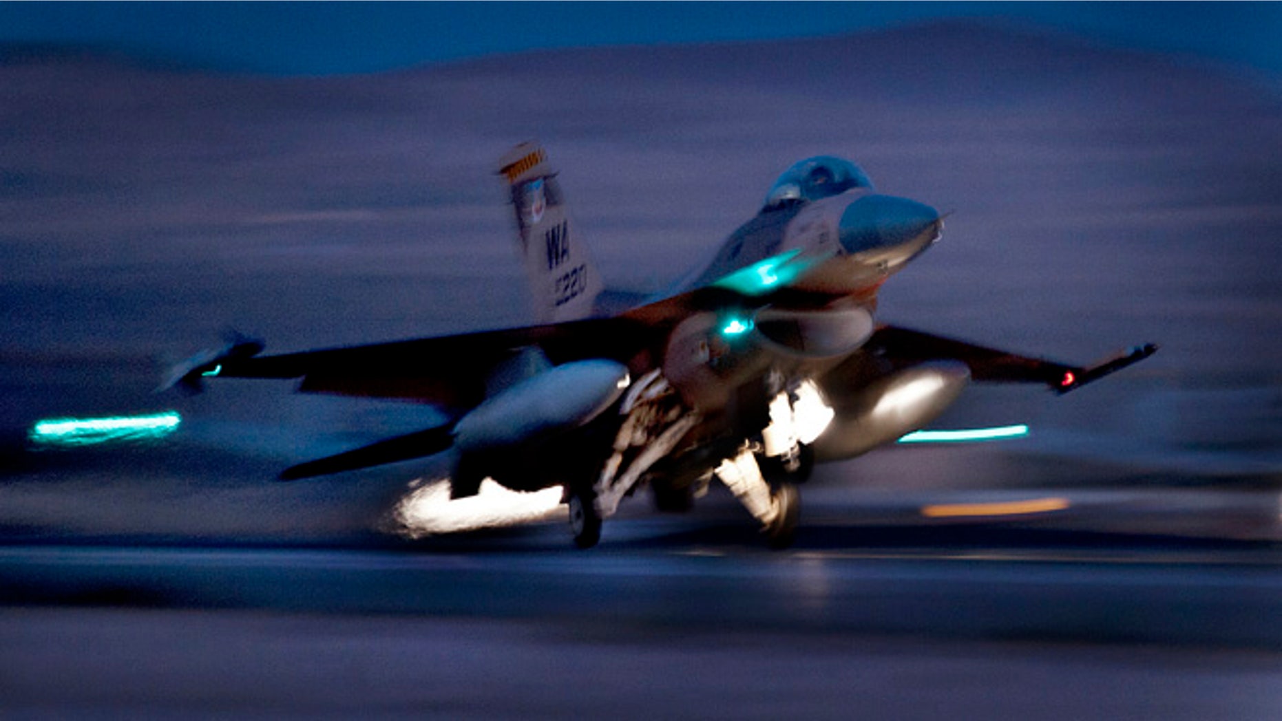 Oct. 30, 2012: An F-16 Fighting Falcon aircraft takes off for a night mission at Nellis Air Force Base, Nev. Air Force F-16 fighters, Civil Air Patrol aircraft and a U.S. Coast Guard MH-65 Dolphin helicopter will all participate in night exercises over Washington, D.C., in early December.