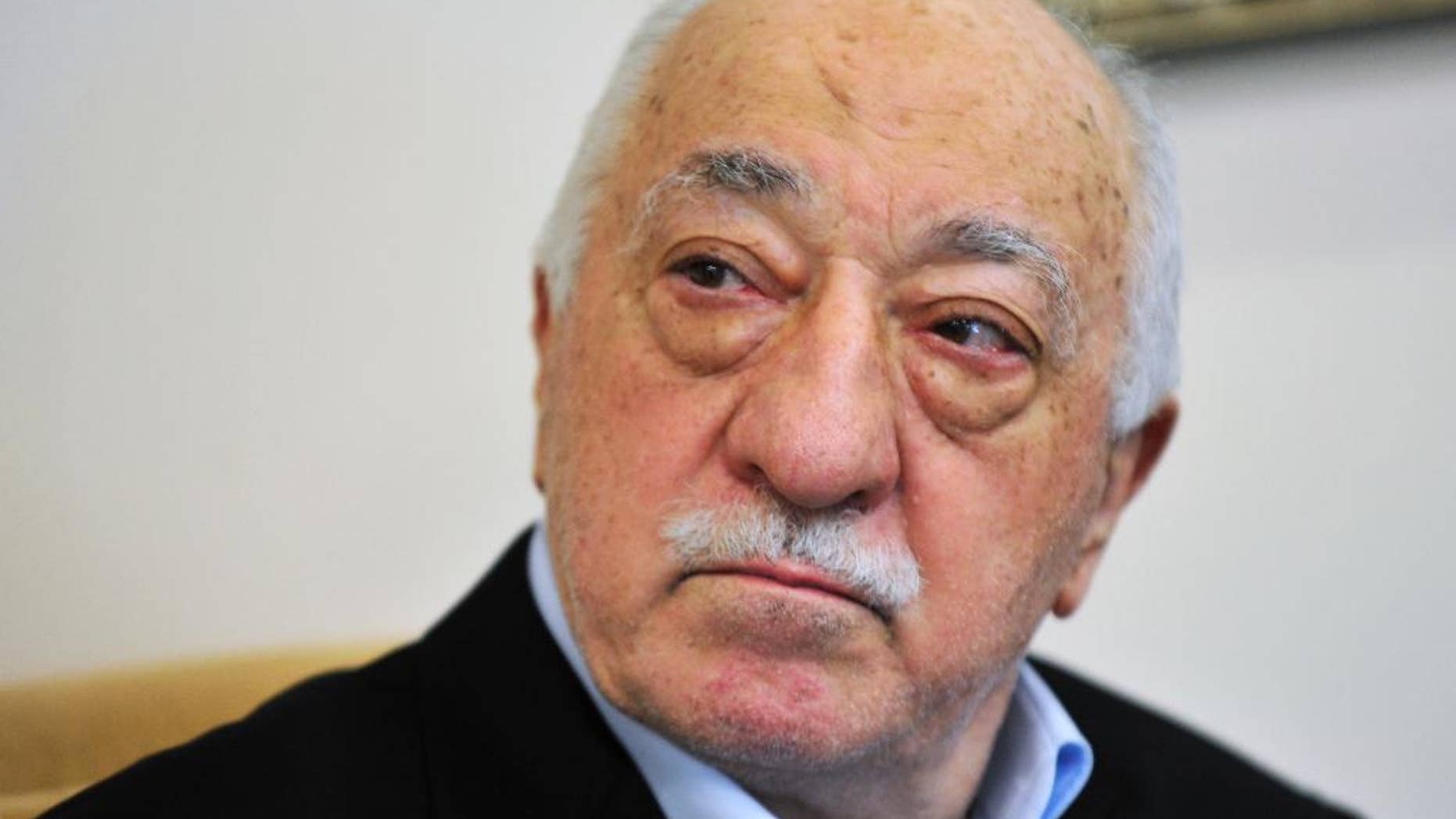 FILE - In this July 2016 file photo, Islamic cleric Fethullah Gulen speaks to members of the media at his compound, in Saylorsburg, Pa. Turkey’s justice minister on Thursday, Oct. 27, 2016, pressed the U.S. to extradite Gulen who he accuses of orchestrating the July failed coup attempt or risk seriously harming relations between the two countries. (AP Photo/Chris Post, File)