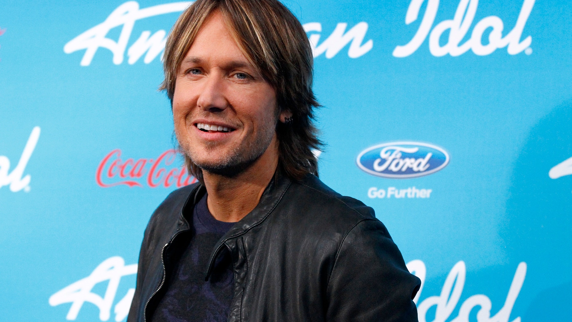 Country singer and judge Keith Urban poses at the party for the finalists of the television show "American Idol" in Los Angeles, California March 7, 2013.