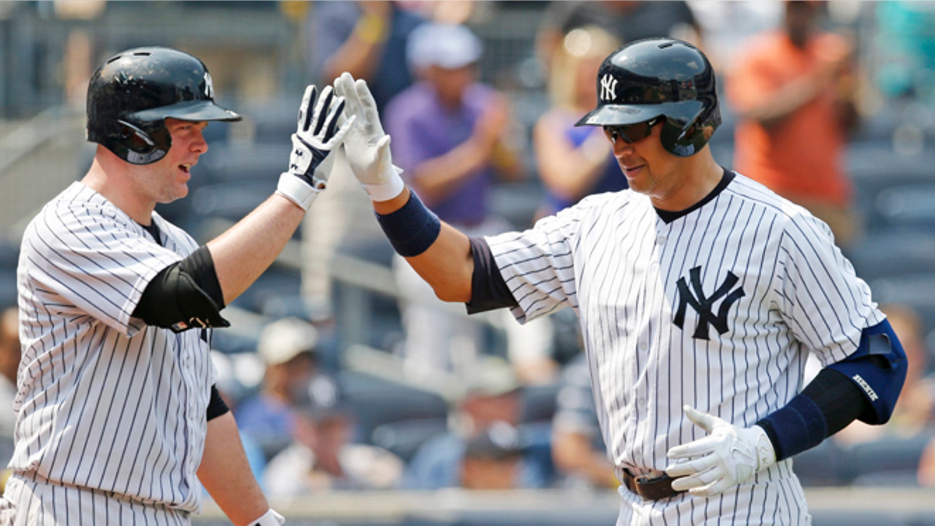 Yankees on-deck batter Brian McCan and Alex Rodriguez at Yankee Stadium in New York, Sunday, July 5, 2015.