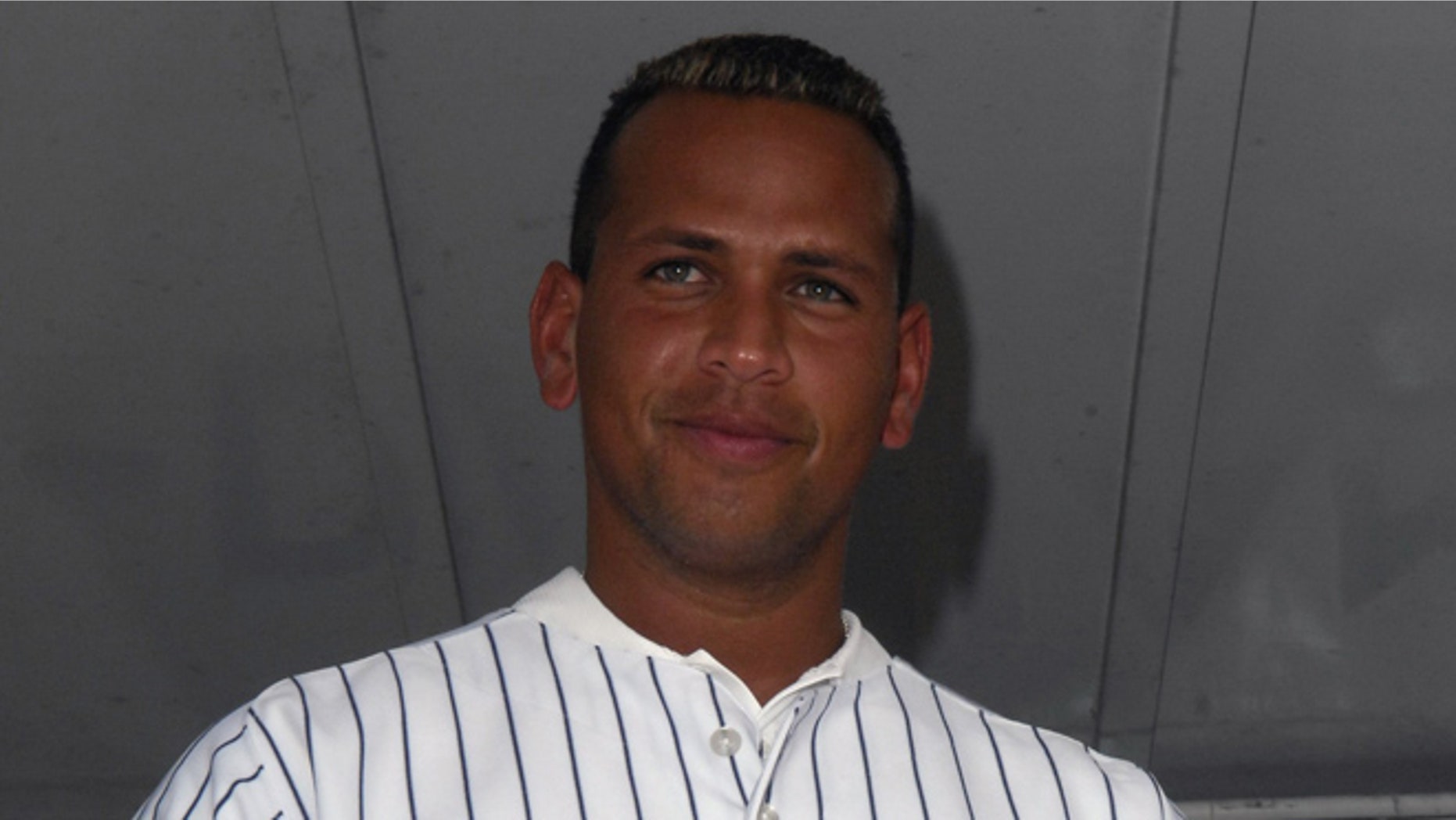 MIAMI , FL - JANUARY 21: Alex Rodriguez is wearing the jersey that he auctioned off at Family Fun Day benefiting the AROD Family Foundation and Ronald McDonald House Charities at The Miami Seaquarium on January 21, 2007 in Miami, Florida. (Photo by Gustavo Caballero/Getty Images for Arod Corporation)