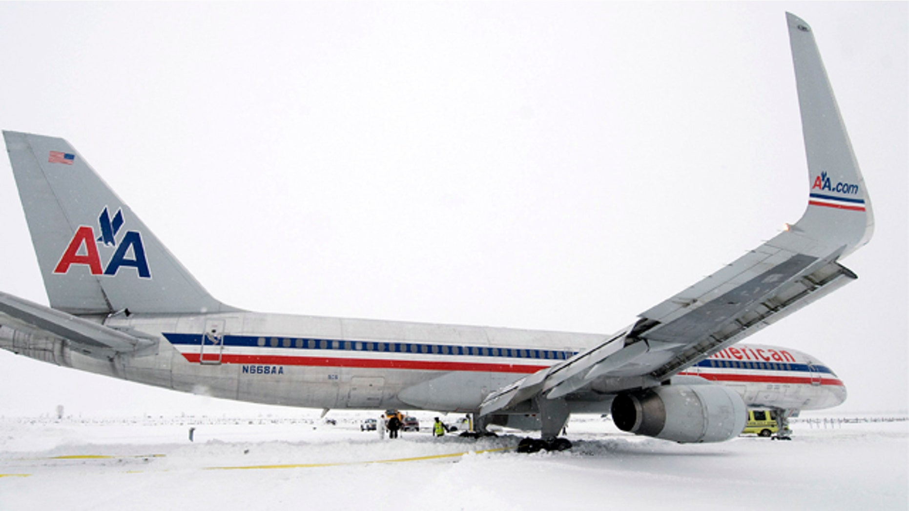 Dec. 29, 2010: Crews work to dig out an American Airlines 757 airplane that slid more than 650 feet off the end of the runway