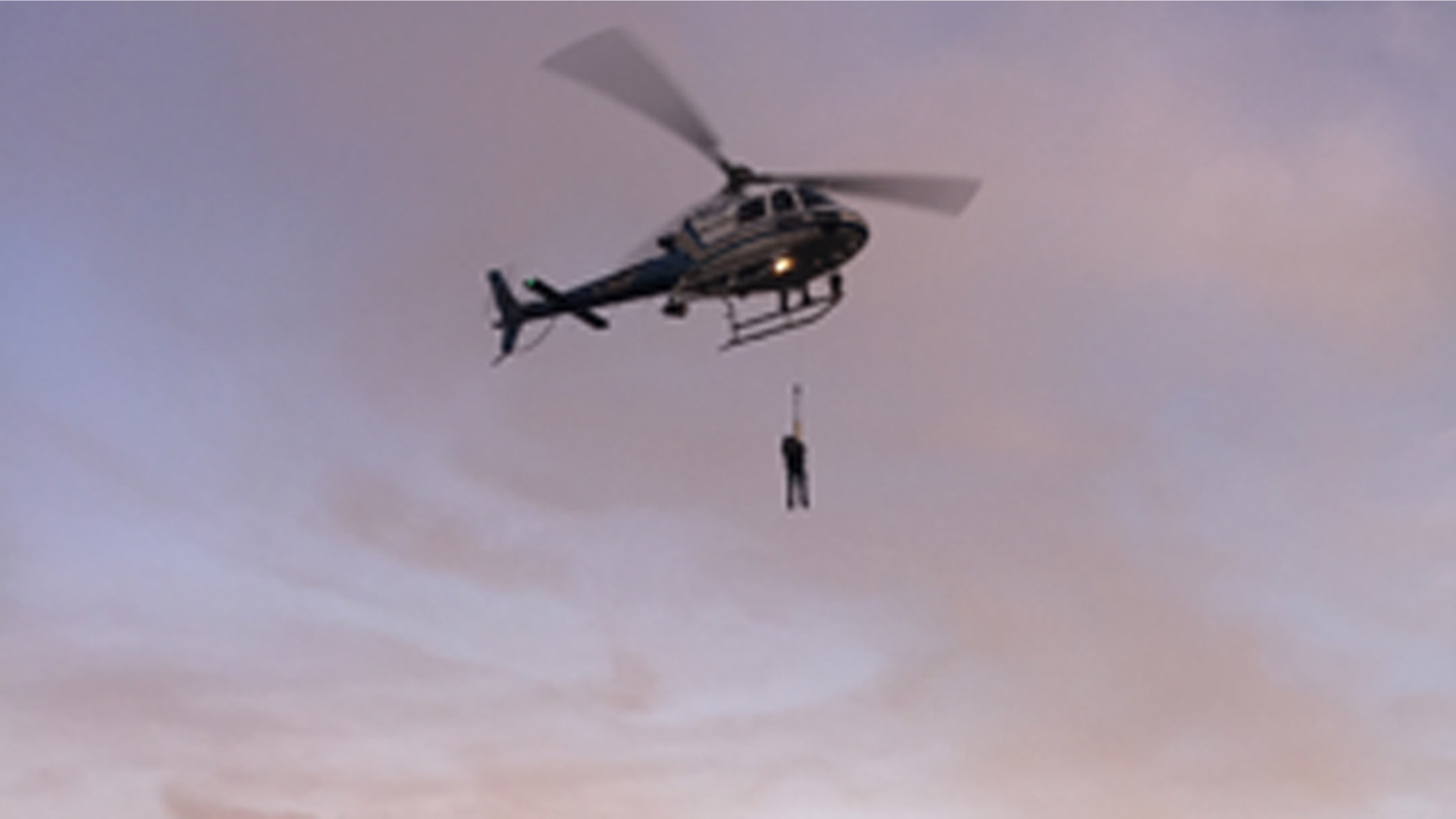 Feb. 26, 2015: In this photo provided by the National Park Service a California Highway Patrol helicopter lifts a suspect to safety during the rescue of two suspected vandals at Golden Gate National Recreation Area. Park service spokeswoman Alexandra Picavet says the men got stuck on a cliff at the waterfront of Fort Baker in Golden Gate National Recreation Area. (AP Photo/U.S. National Park Service)