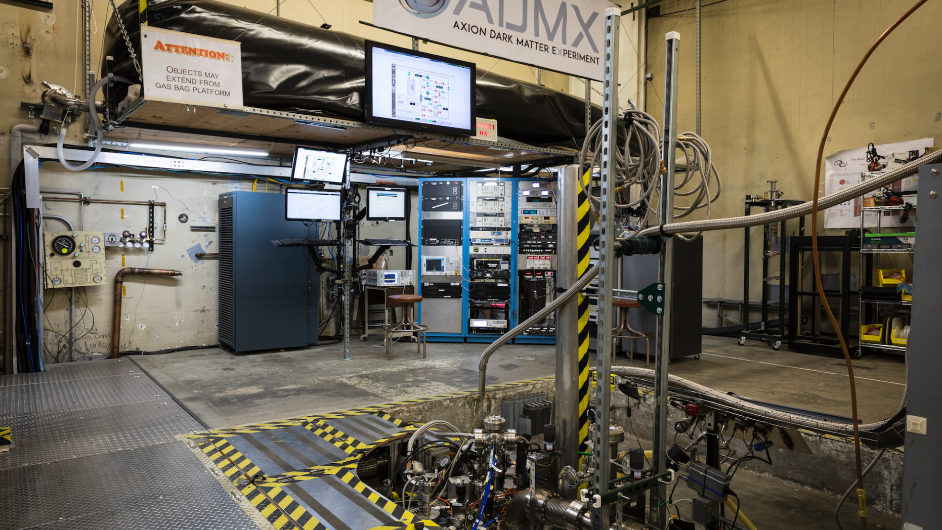 The ADMX dark matter detector is located underground in an experiment hall at the University of Washington in Seattle, surrounded by a magnetic field.
