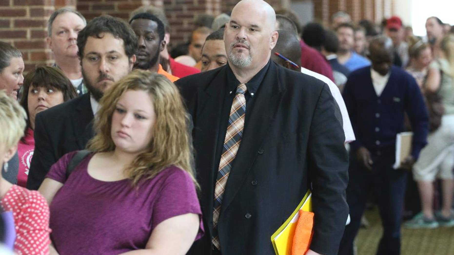 In this April 2, 2015 photo, David Dunn from Chickamauga, Ga., right, stands in line with hundreds of other job seekers at The Colonnade in Ringgold, Ga. to attend a huge 15-county job fair. Payroll processor ADP reports how many jobs private employers added in April on Wednesday, May 6, 2015. (Dan Henry/Chattanooga Times Free Press via AP) THE DAILY CITIZEN OUT; NOOGA.COM OUT; CLEVELAND DAILY BANNER OUT; LOCAL INTERNET OUT