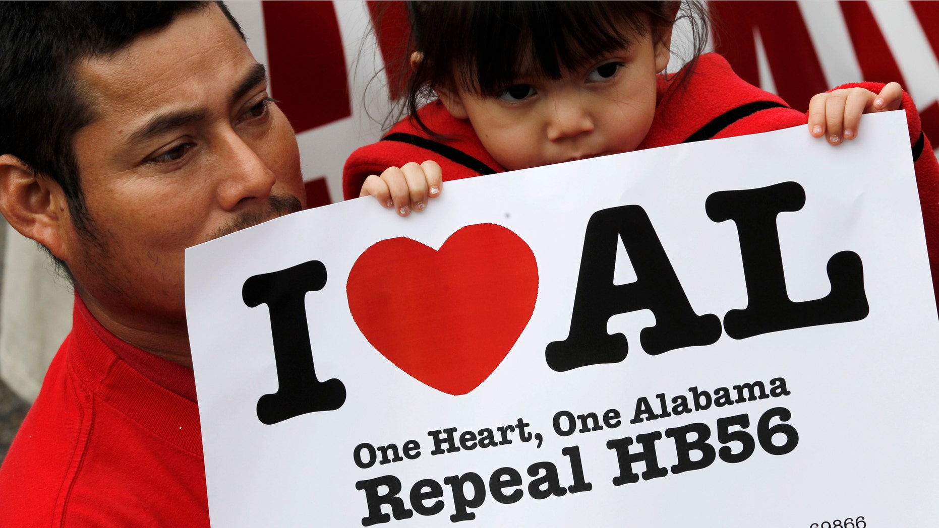Opponents of Alabama's immigration law gather for a rally outside the Statehouse in Montgomery, Ala., on Tuesday, Feb. 14, 2012. Â The group was calling for the repeal of HB56 which is considered to be among the strongest immigration laws in the country. (AP Photo/Dave Martin)