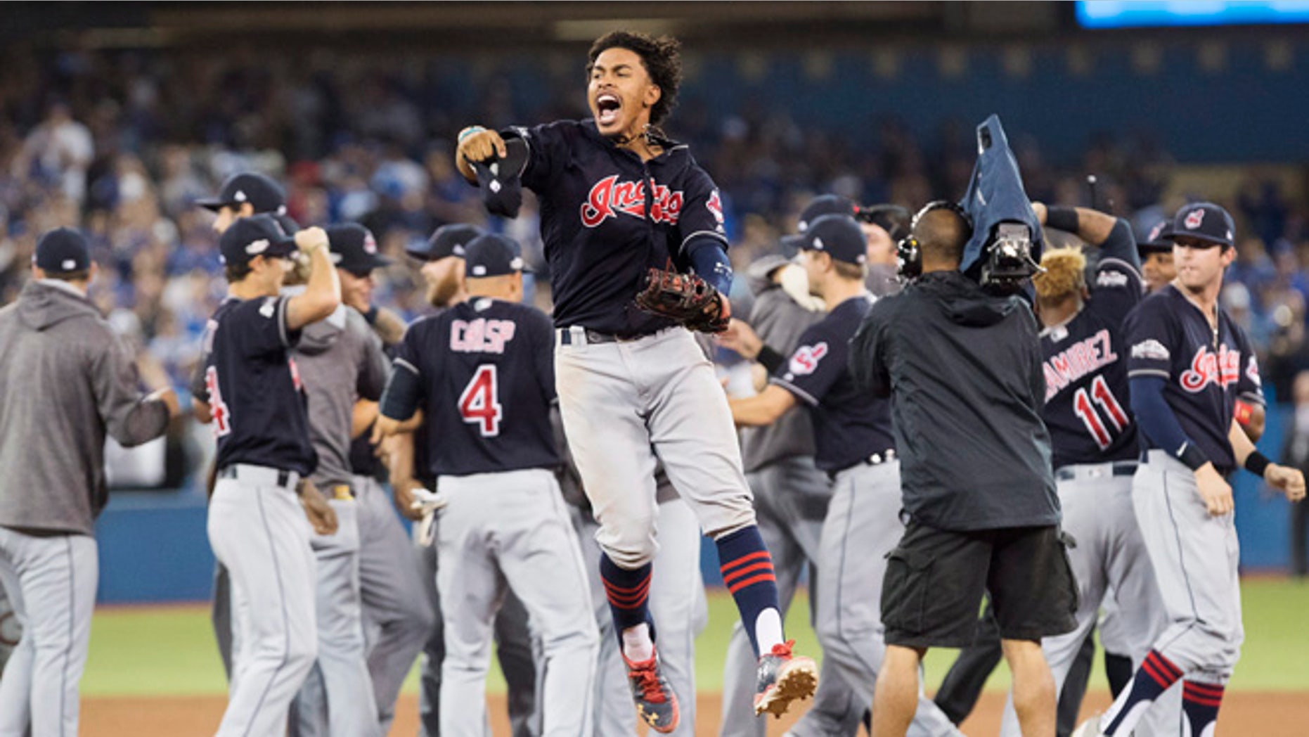 Cleveland Indians shortstop Francisco Lindor celebrates after the Indians defeated the Toronto Blue Jays 3-0 Game 5 of the baseball American League Championship Series in Toronto on Wednesday, Oct. 19, 2016. (Mark Blinch/The Canadian Press via AP)