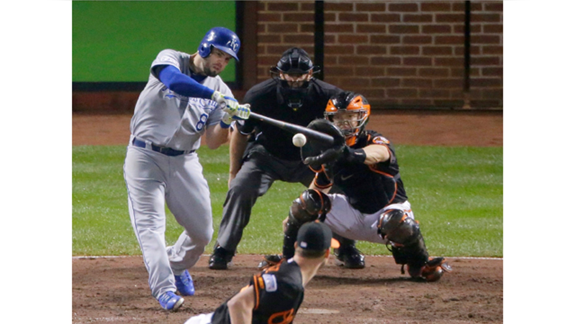October 11, 2014: Kansas City Royals' Mike Moustakas (8) hits a two-run home run during the 10th inning of Game 1 of the American League baseball championship series against the Baltimore Orioles. (AP Photo/Charlie Riedel)
