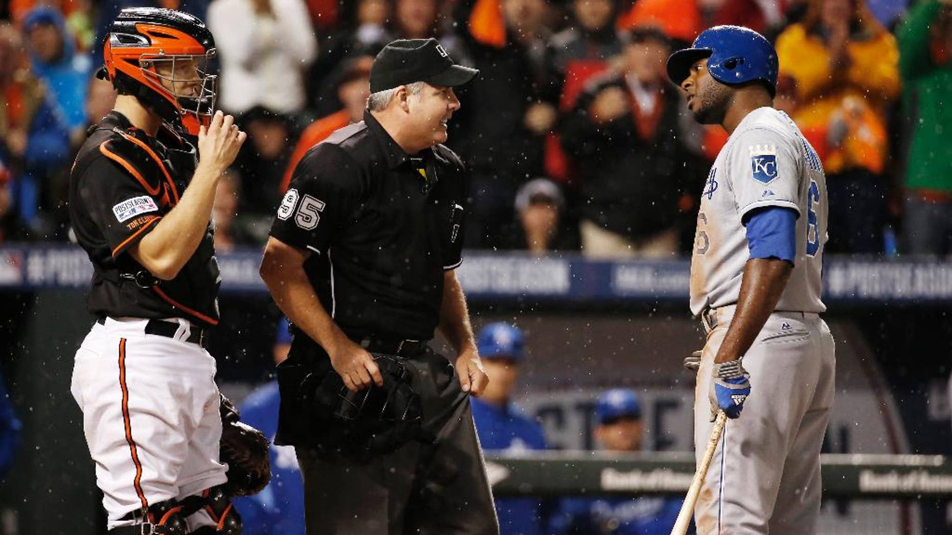 Kansas City Royals' Lorenzo Cain (6) argues a call with umpire Tim Timmons after striking out during seventh inning of Game 1 of the American League baseball championship series against the Baltimore Orioles Friday, Oct. 10, 2014, in Baltimore. (AP Photo/Alex Brandon)