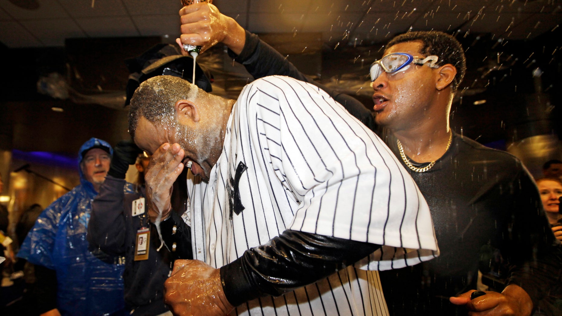 Oct. 12, 2012: New York Yankees starting pitcher CC Sabathia is doused with champagne by teammate Ivan Nova, right, after Game 5 of the American League division baseball series against the Baltimore Orioles in New York.