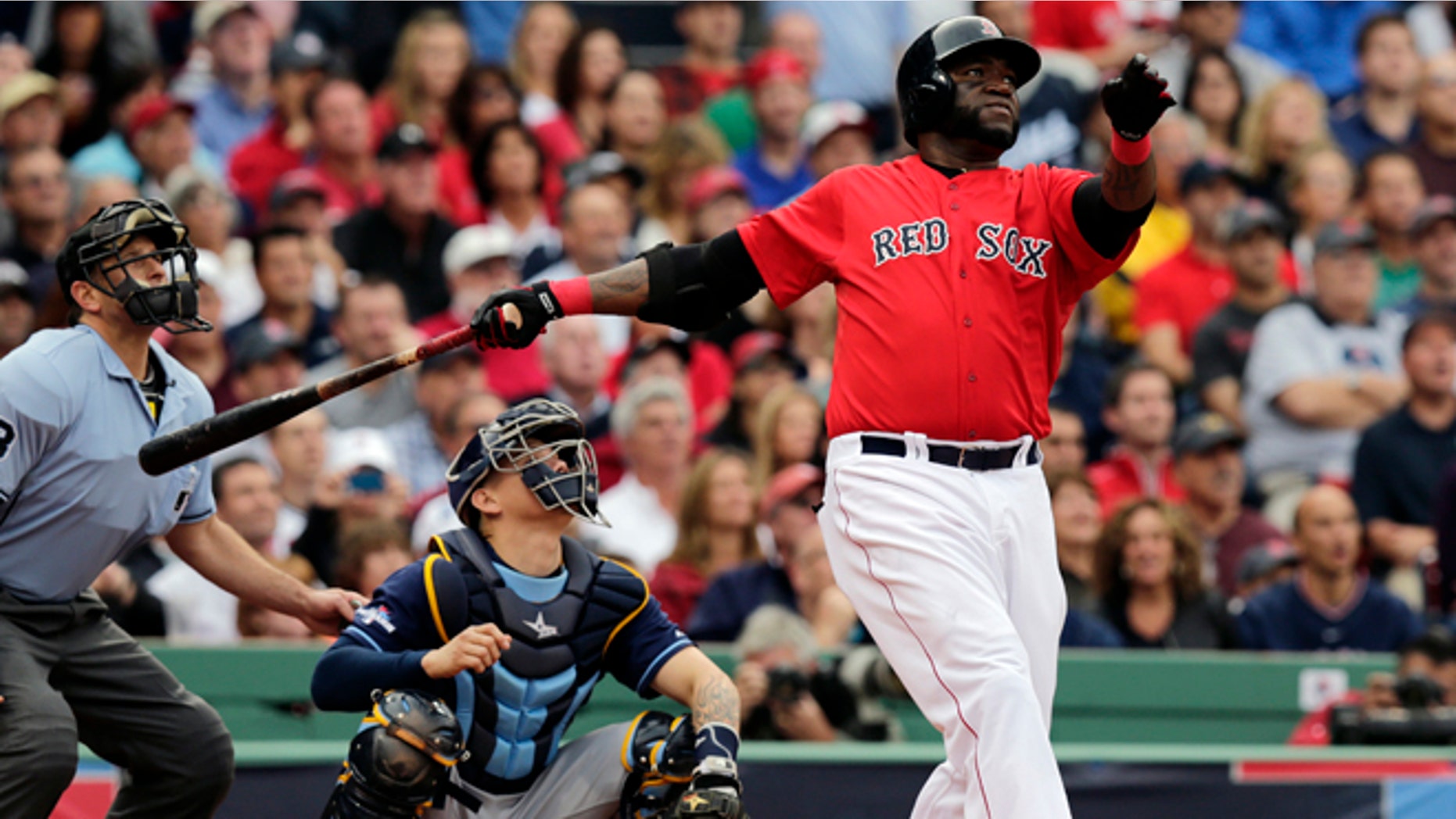 Boston Red Sox designated hitter David Ortiz, right, watches his ground rule double in front of Tampa Bay Rays catcher Jose Lobaton in the fourth inning in Game 1 of baseball's American League division series, Friday, Oct. 4, 2013, in Boston. (AP Photo/Charles Krupa)