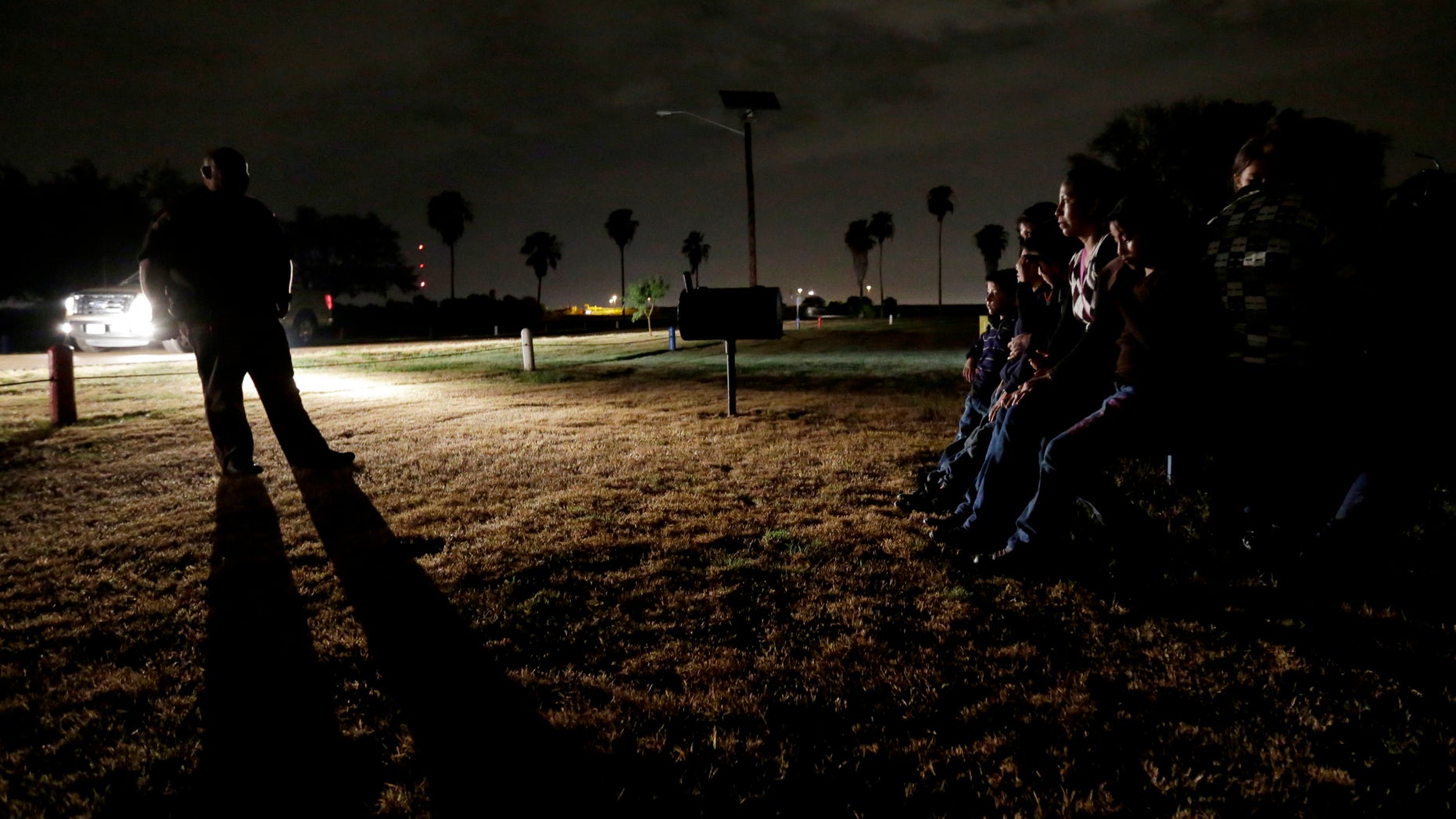 June 25, 2014: A group of immigrants from Honduras and El Salvador, who crossed the U.S.-Mexico border illegally, are stopped in Granjeno, Texas. Just since October, the Border Patrols Rio Grande Valley sector has made more than 194,000 arrests, nearly triple that of any other sector. (AP/Eric Gay)