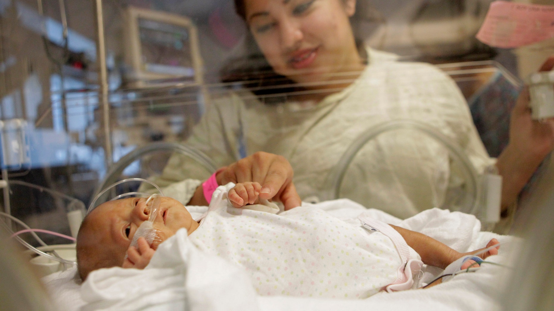 At birth, Melinda Star Guido tipped the scales at only 9 1/2 ounces, less than a can of soda. (AP Photo/Jae C. Hong)