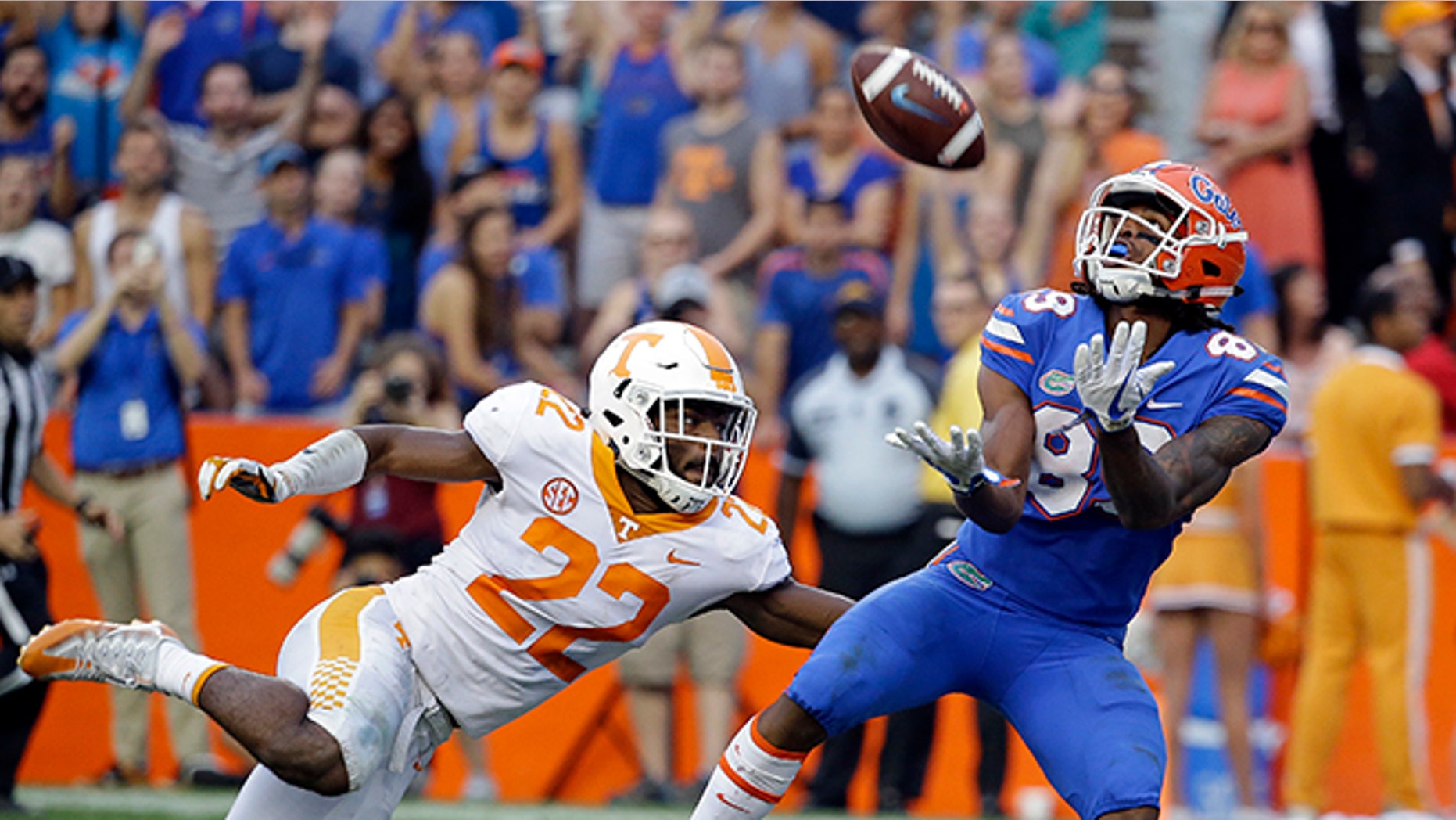 Florida wide receiver Tyrie Cleveland, right, catches the game winning 63-yard touchdown pass in front of Tennessee defensive back Micah Abernathy (22) as time expired in the fourth quarter of an NCAA college football game, Saturday.