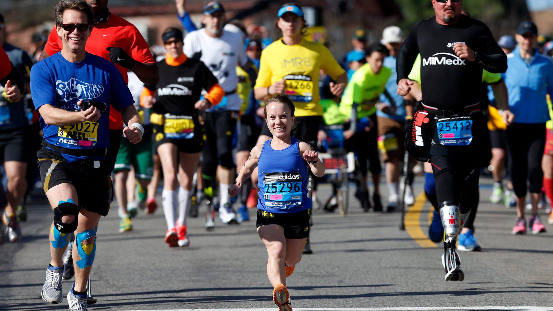 Runners are seen at the Boston Marathon in Hopkinton, Mass.