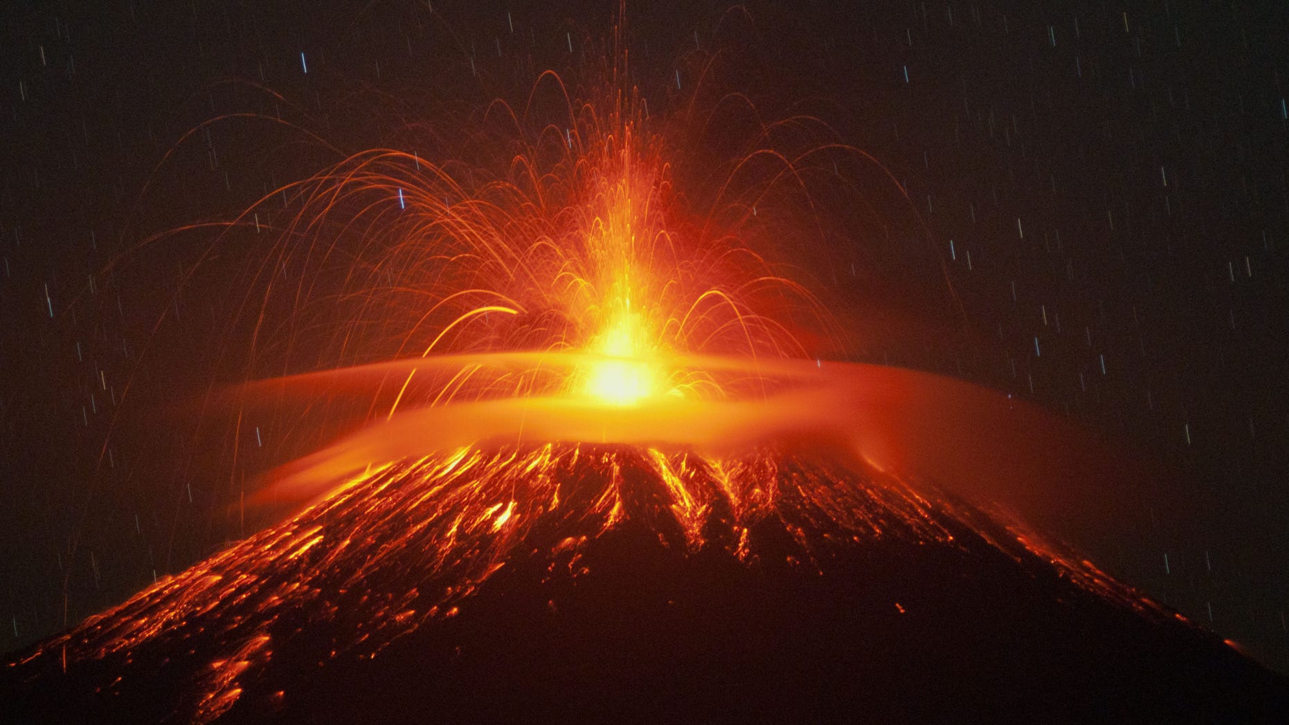File photo: Mount Slamet spews lava and gas during its eruption as seen from Pandansari village in Brebes, Central Java, Indonesia, Thursday, Sept. 18, 2014. (AP Photo/Idhad Zakaria)