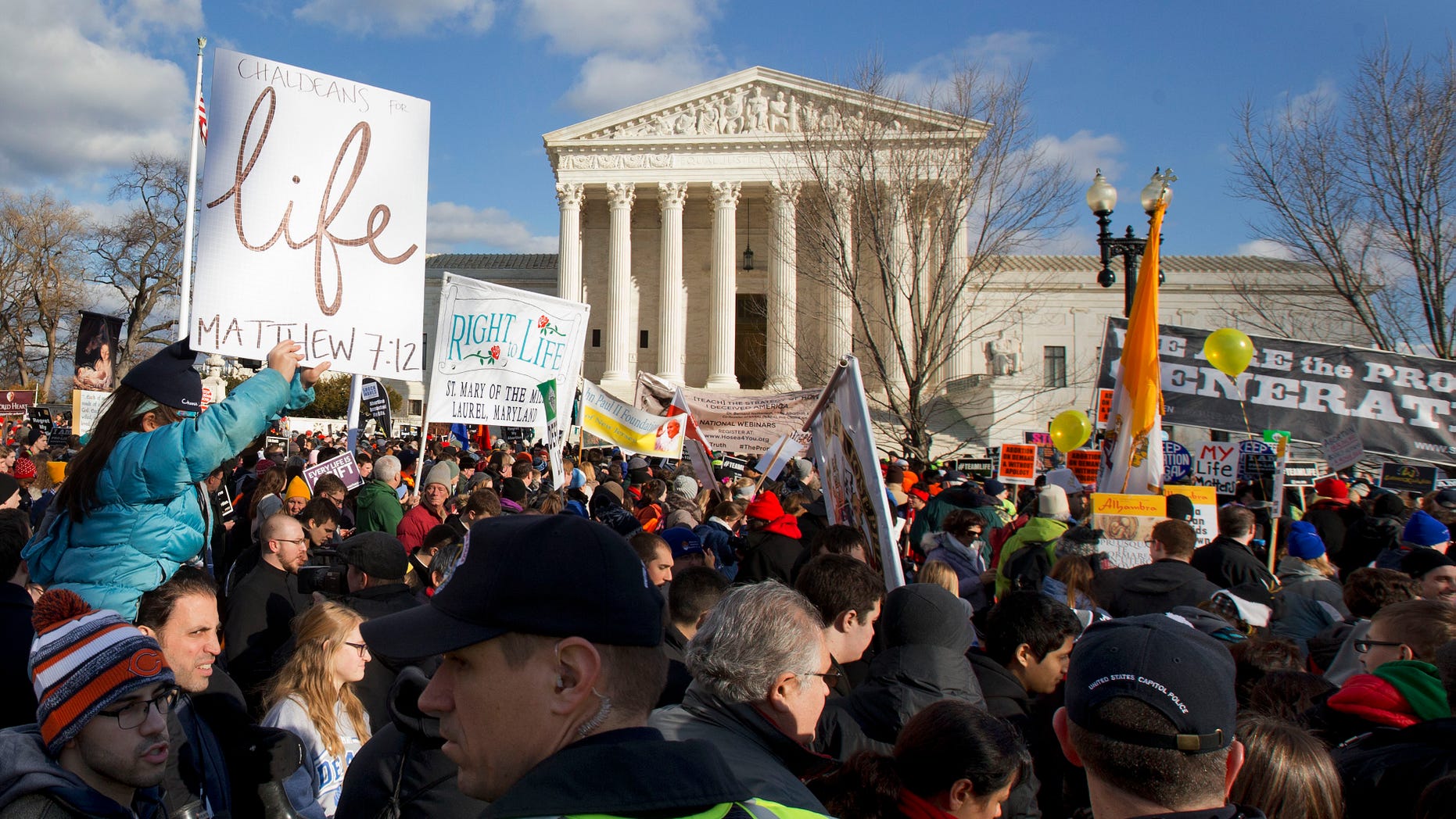 FILE -- Jan. 22, 2015: Anti-abortion demonstrators march past the Supreme Court in Washington during the annual March for Life.