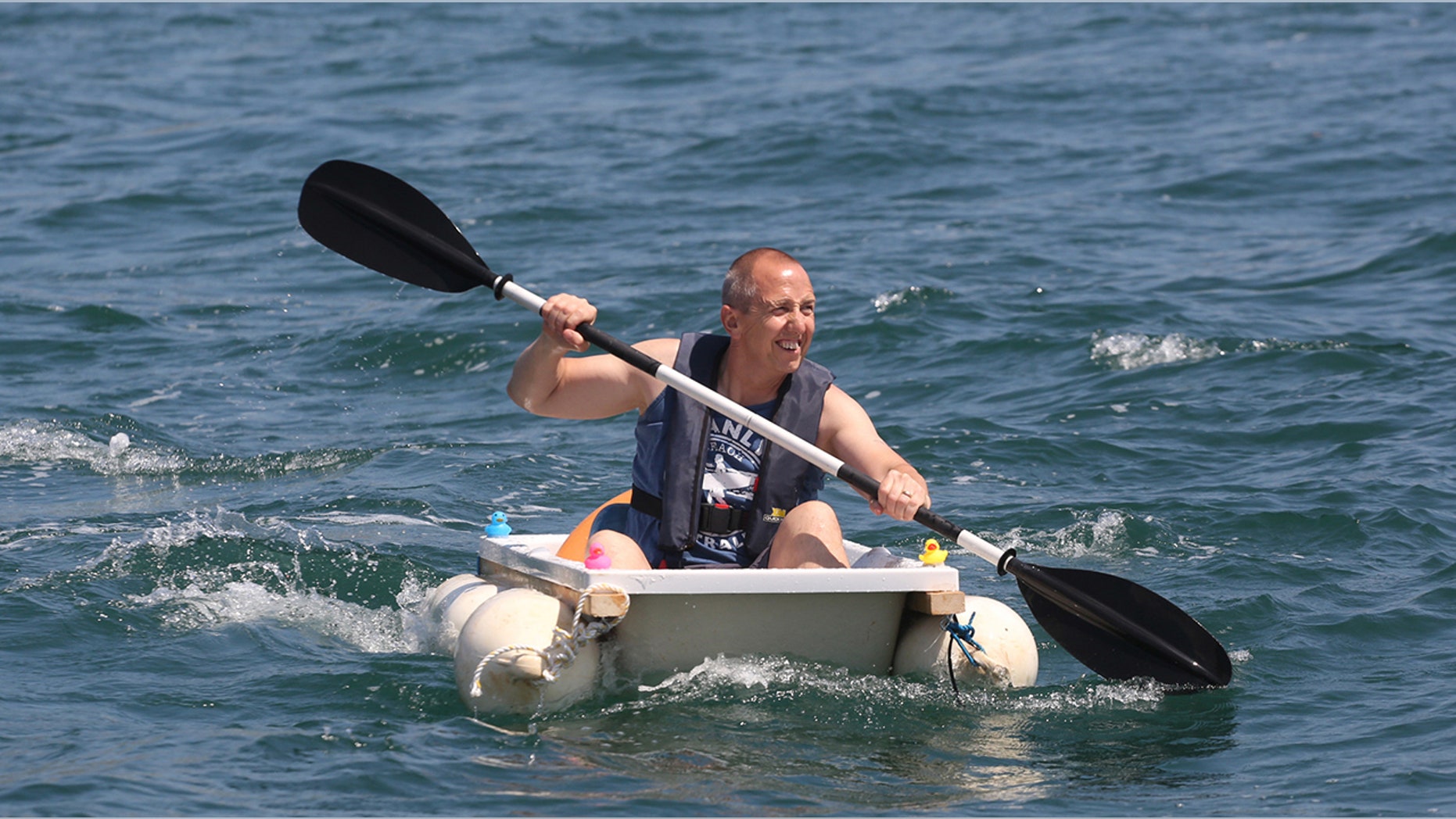 Plumber Iain Bevan, 51, rows across seas at Torbay inside a bath tub to raise money for charity.