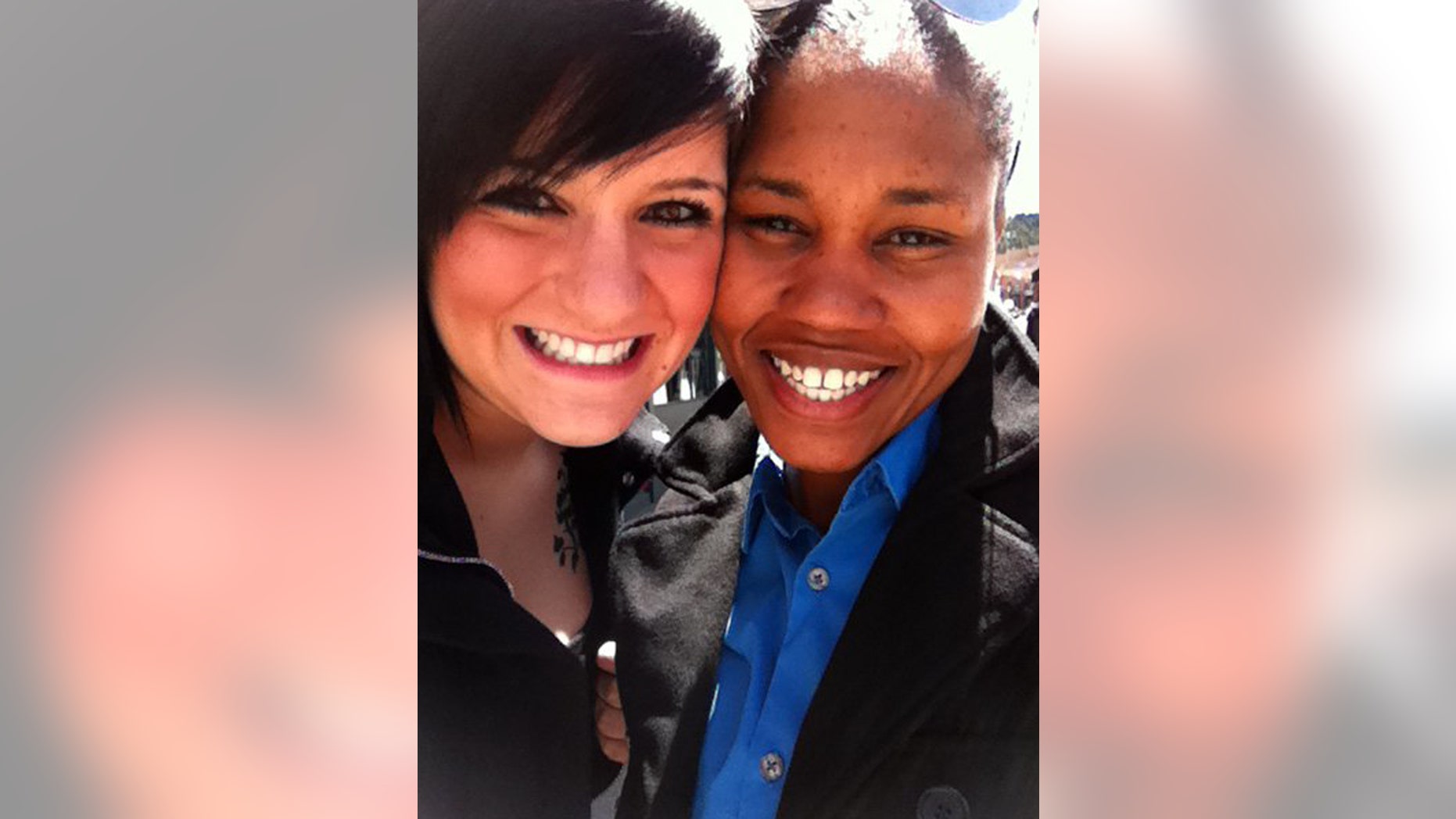 In this undated photograph made available by Allison Hanson, Hanson, left, poses with her partner, Sgt. Karen Alexander. Alexander, who is stationed at Fort Bragg, N.C., married Hanson in Washington.
