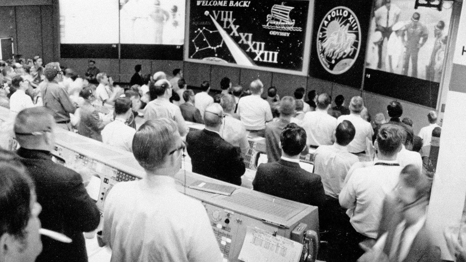 The view from NASA's Mission Operations Control Room as the Apollo 13 crew is welcomed aboard the USS Iwo Jima on April 17, 1970 following a perilous flight around the moon by astronauts James Lovell, Fred Haise and Jack Swigert.