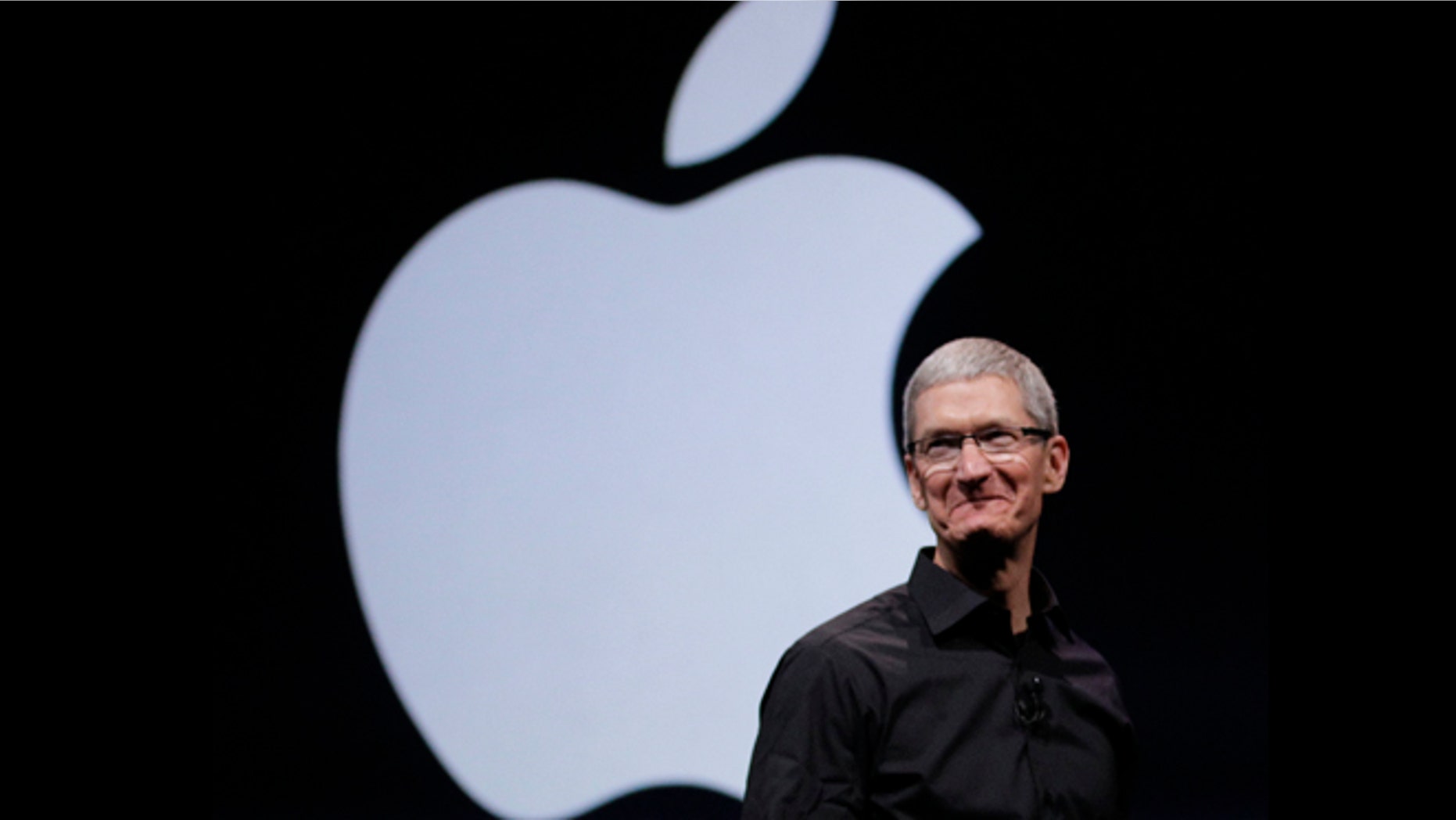 Sept. 12, 2012: Apple CEO Tim Cook walks on stage at the beginning of an event in San Francisco, where the company is expected to announce a new iPhone.