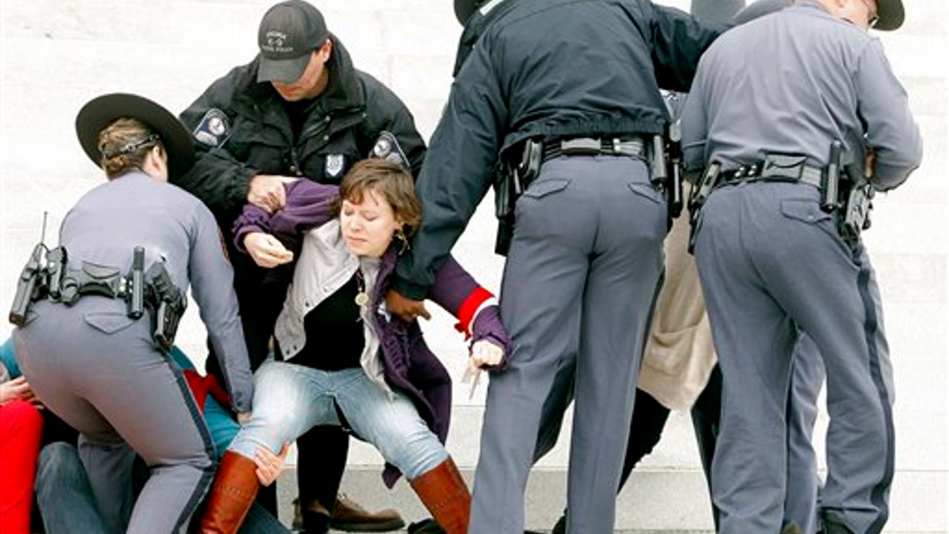 March 3: Protesters are removed from the front steps of the State Capitol in Richmond, Va.