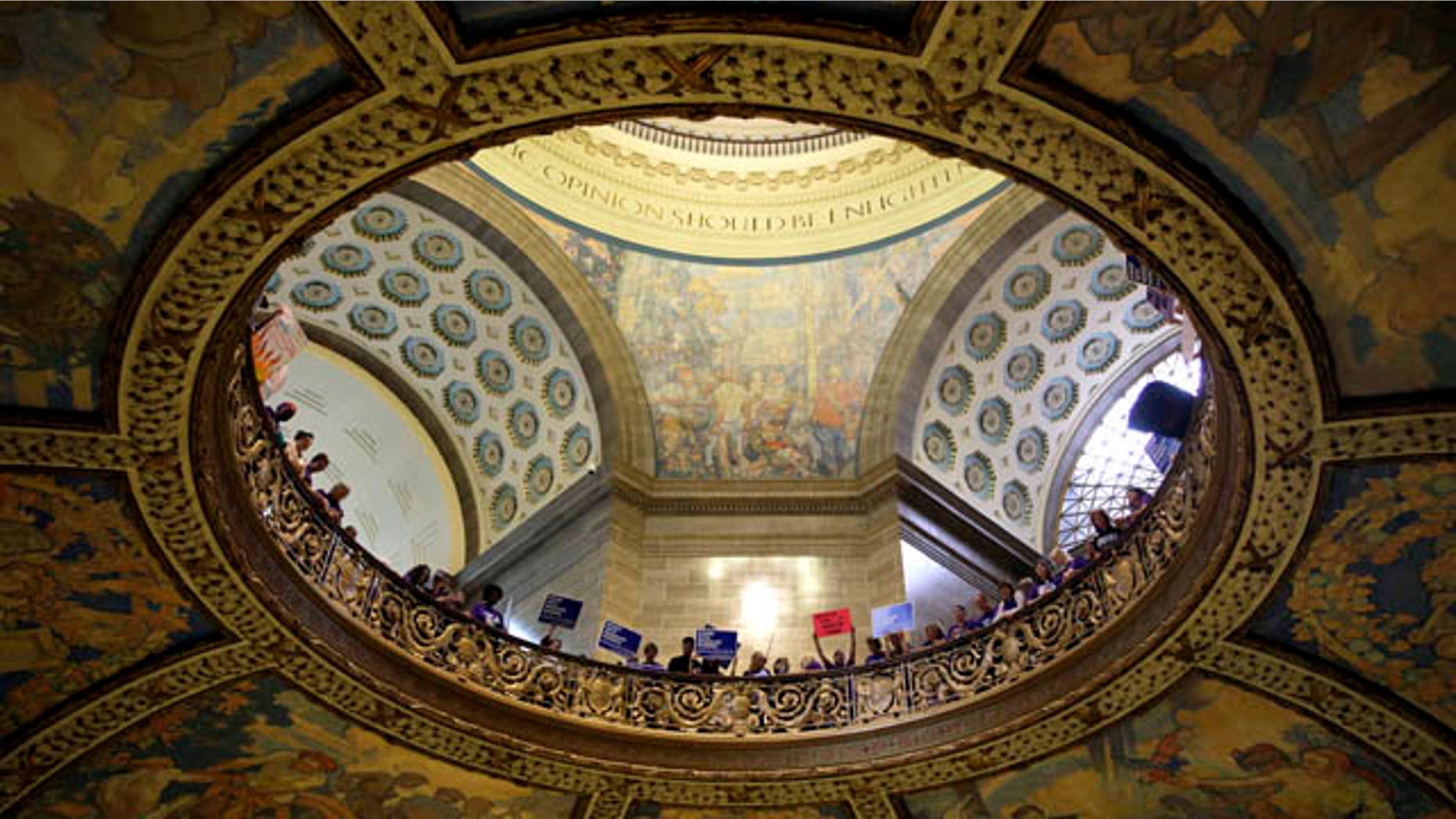 September 10, 2014: Abortion rights activists hold signs inside the Missouri Capitol in Jefferson City, Mo. (AP Photo/Jeff Roberson)