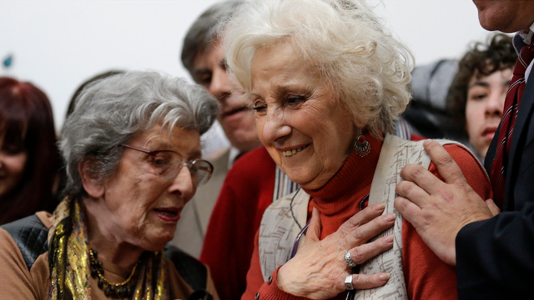 August 5, 2014: Estela de Carlotto, president of Grandmothers of Plaza de Mayo, right, reacts before a news conference in Buenos Aires, Argentina. Carlotto, one of the most prominent human rights activists in Argentina, has located the grandson born to her daughter Laura in captivity during the military dictatorship that ruled Argentina from 1976-1983. Laura was kidnapped and killed by the military in August 1978. (AP Photo/Victor R. Caivano)