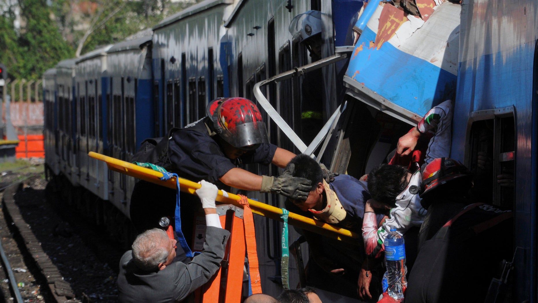 Feb. 22, 2012: Firemen rescue wounded passengers from a commuter train after a collision in Buenos Aires, Argentina.