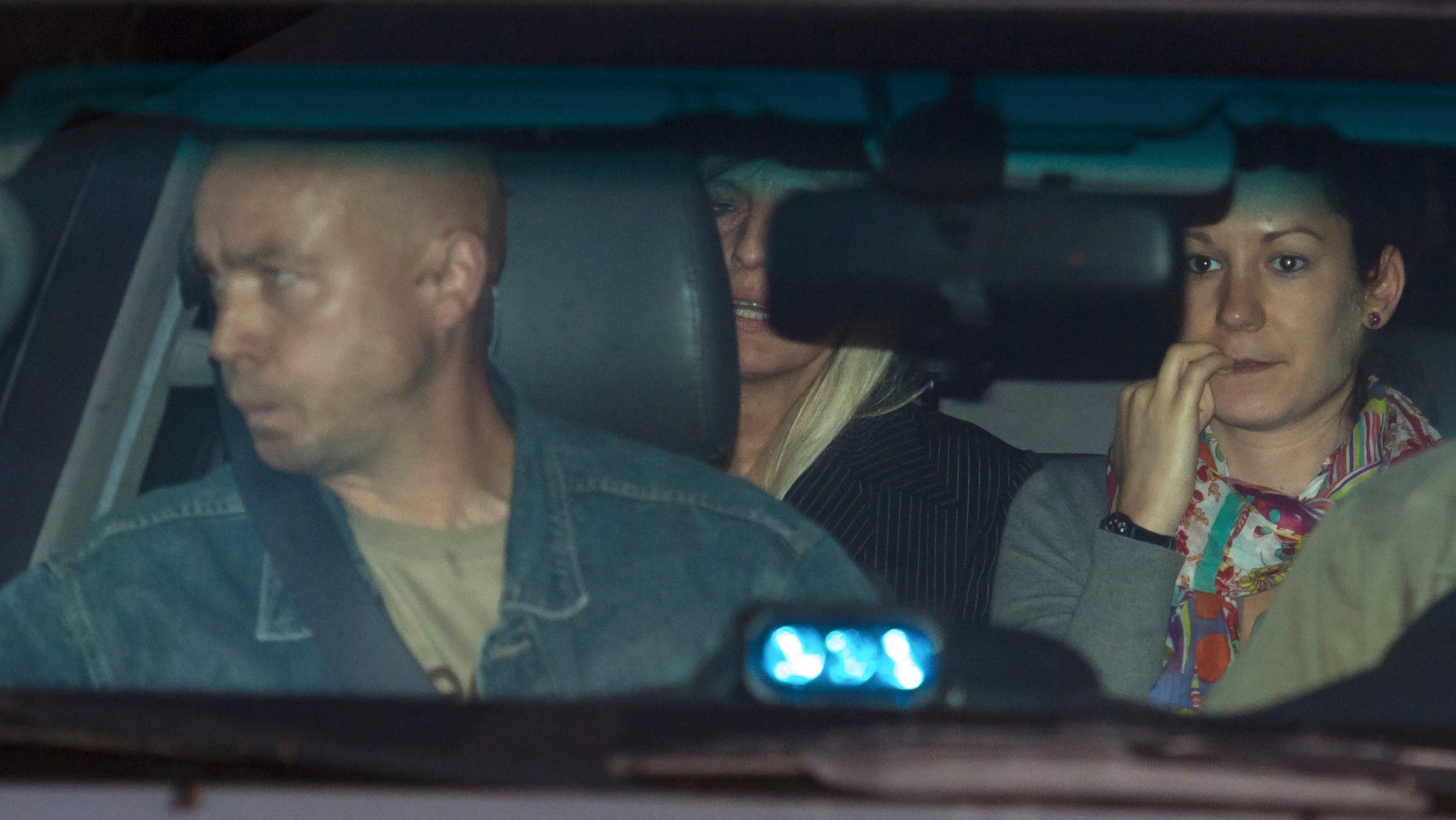 Aug. 28, 2012: Michelle Martin, partially obscured at center, ex-wife of Belgium's child killer Marc Dutroux leaves prison in Brussels.