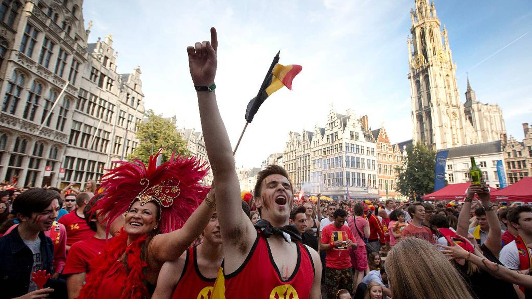Belgian fans cheer after Belgium scored a goal as they watch the soccer match on a giant screen in the Grote Markt in Antwerp, Belgium on Sunday, June 22, 2014. Belgium scored a 1-0 victory over Russia during the group H World Cup soccer match between Belgium and Russia at the Maracana Stadium in Rio de Janeiro, Brazil. (AP Photo/Virginia Mayo)